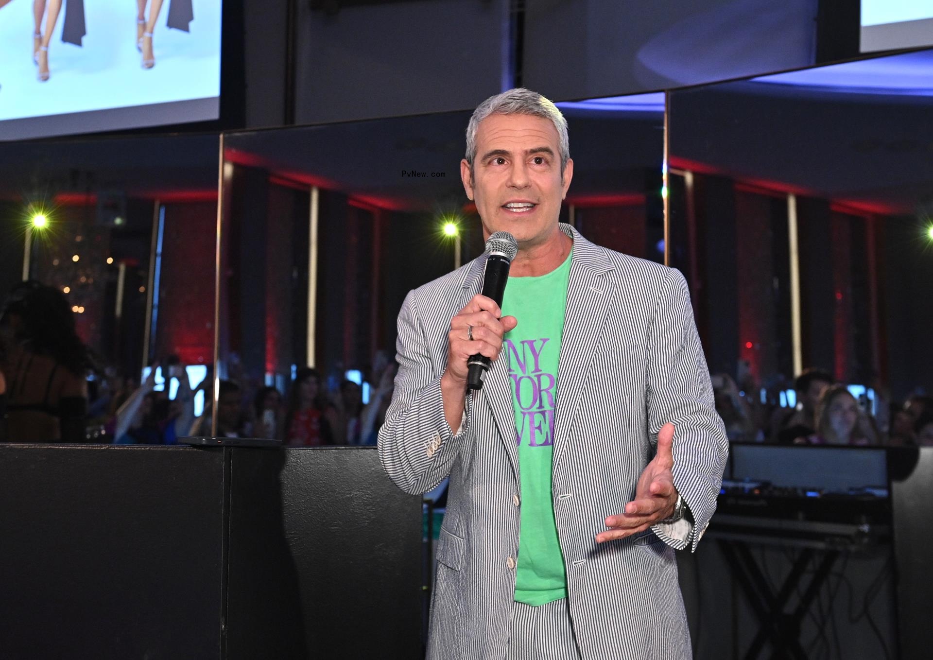 Andy Cohen speaking into a microphone.