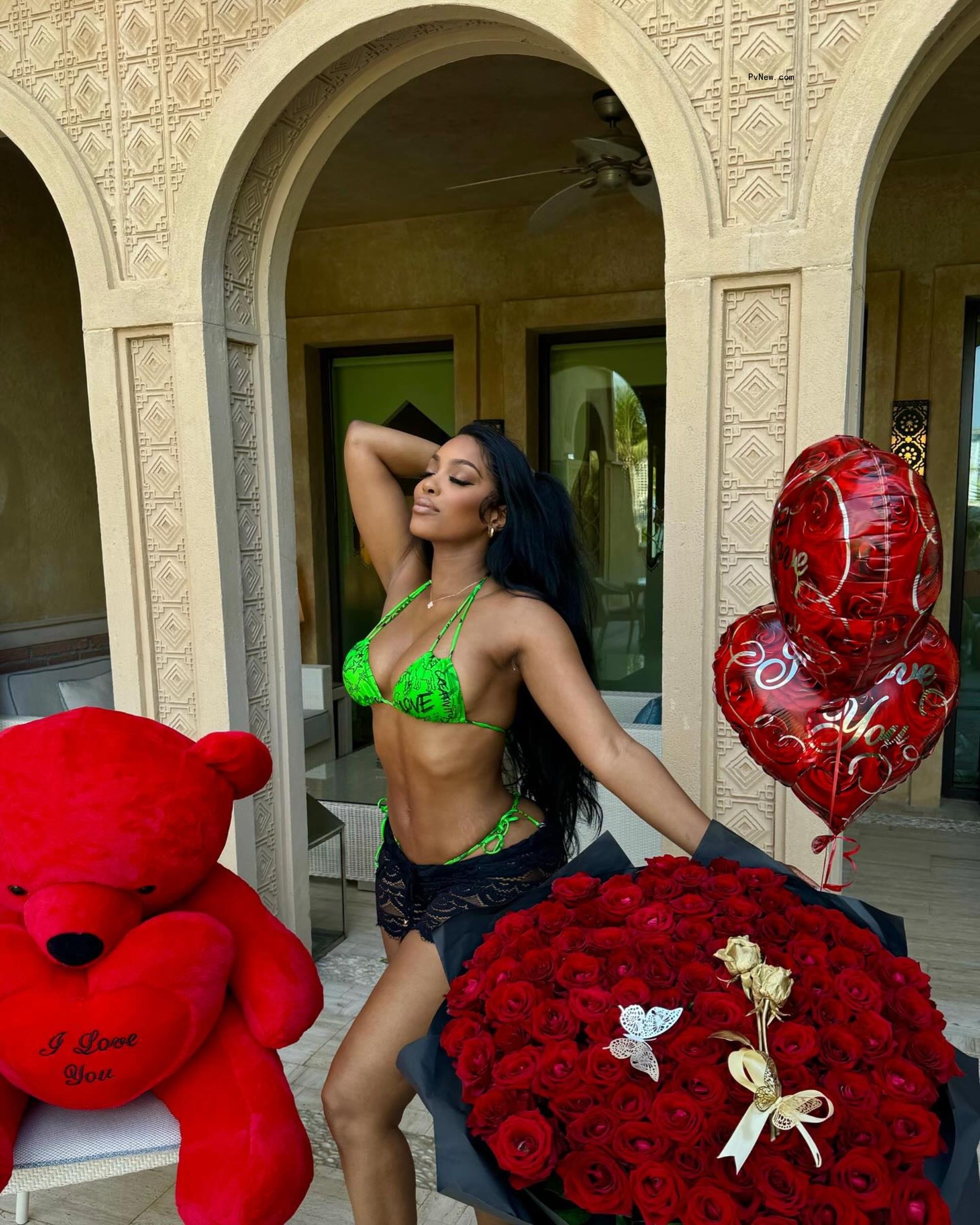 Porsha Williams posing with roses and balloons