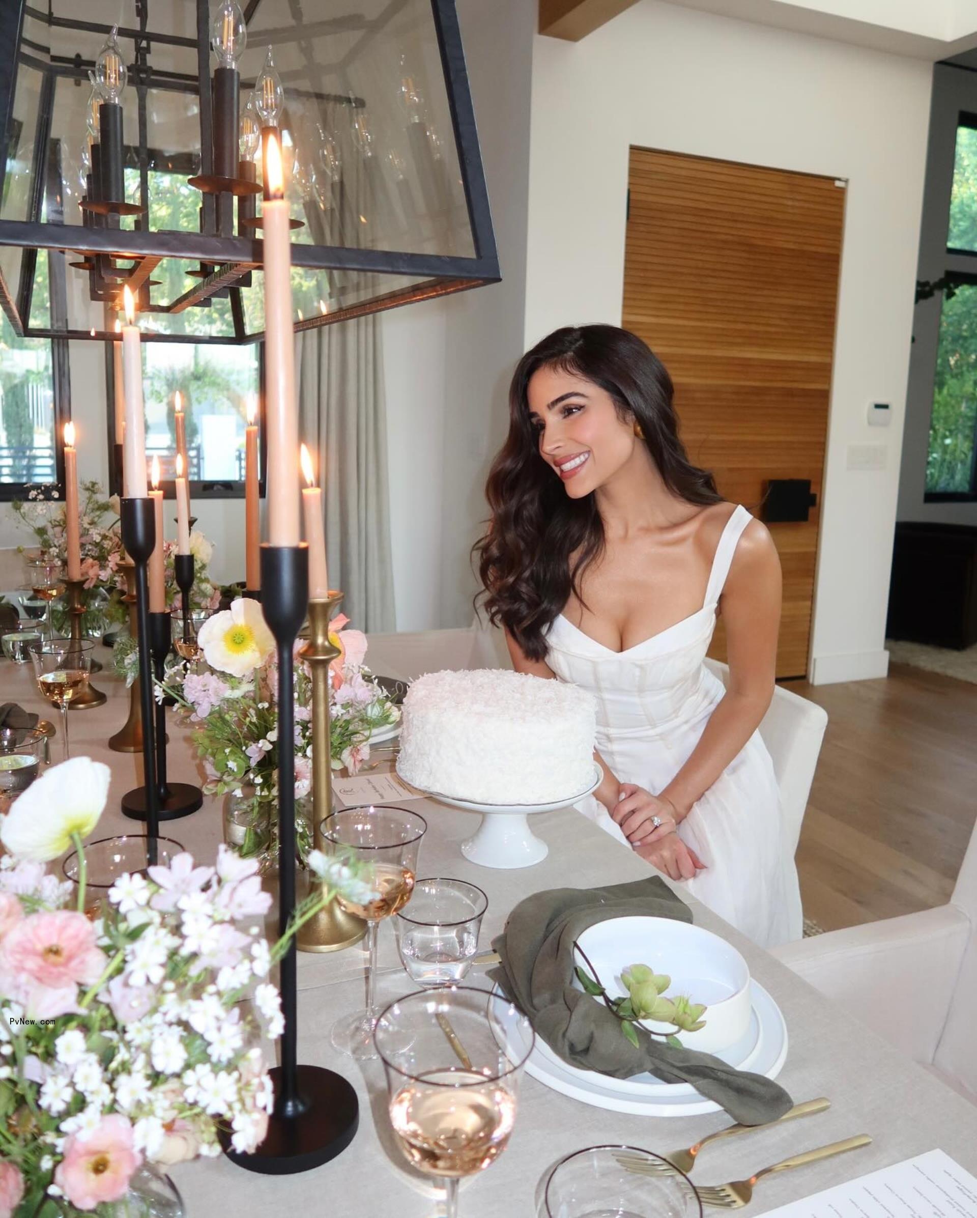Olivia Culpo in a white dress.