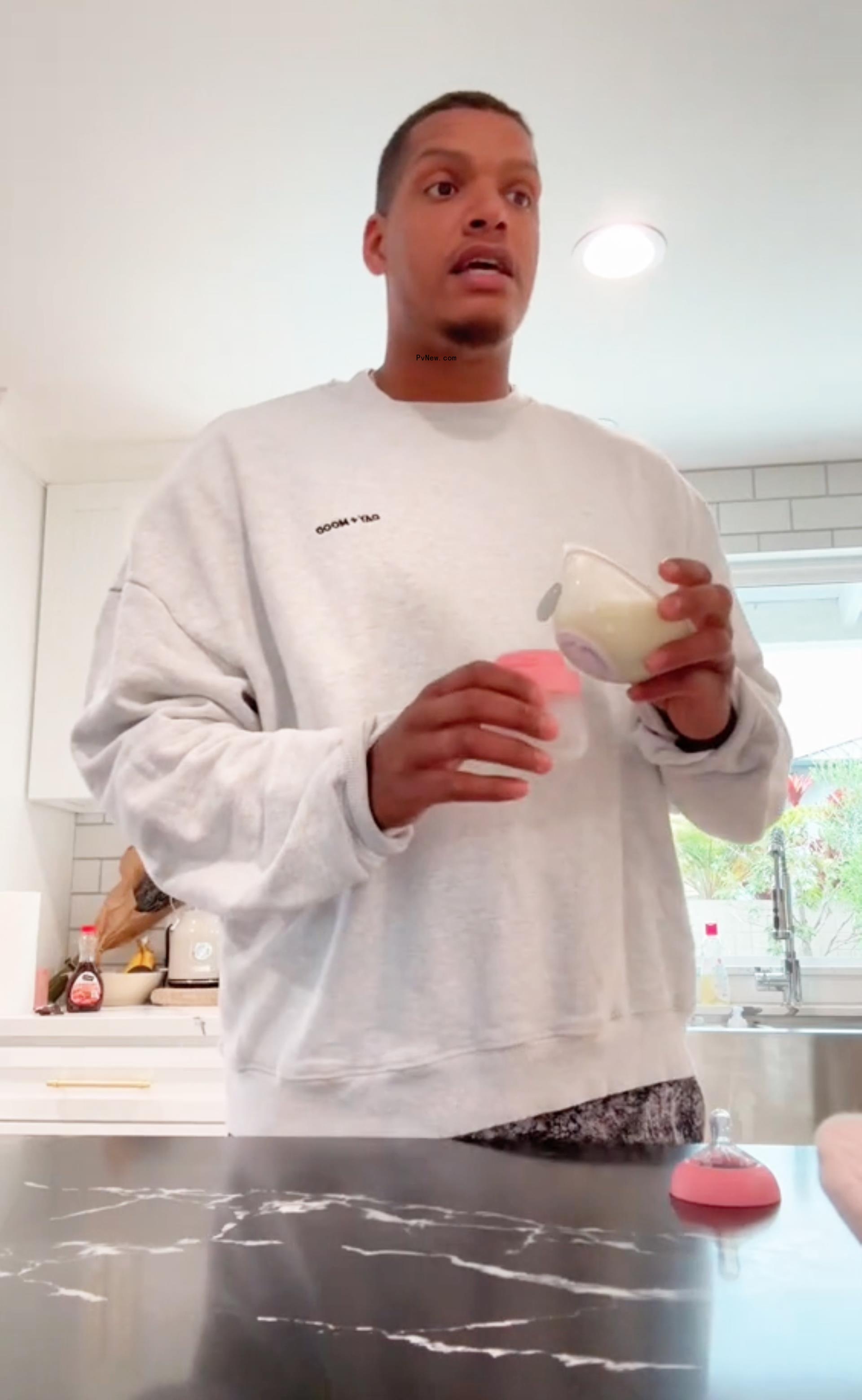 Isaac Rochell making his daughter's bottle.