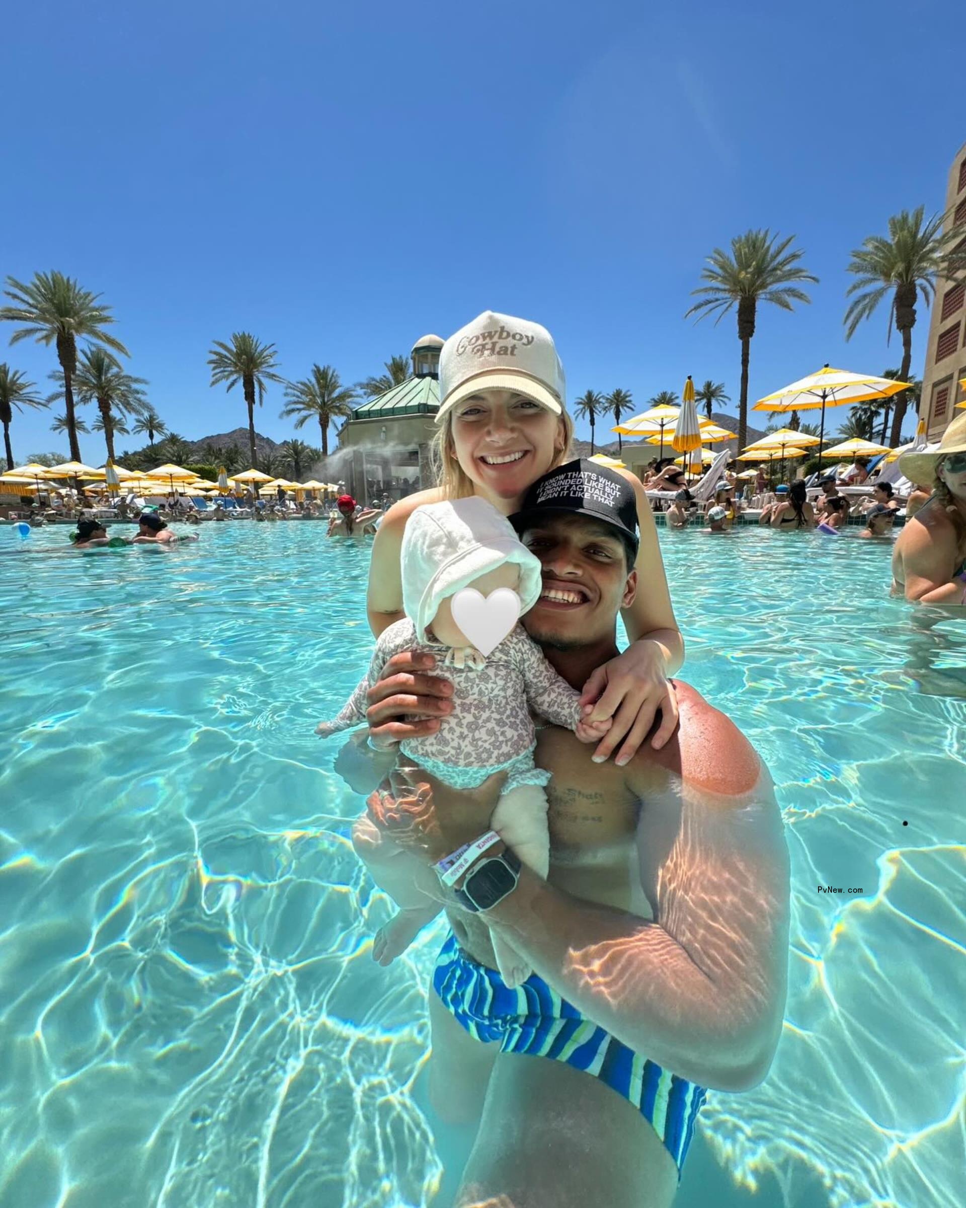 Allison Kucharczyk, Isaac Rochell and their daughter in the pool.