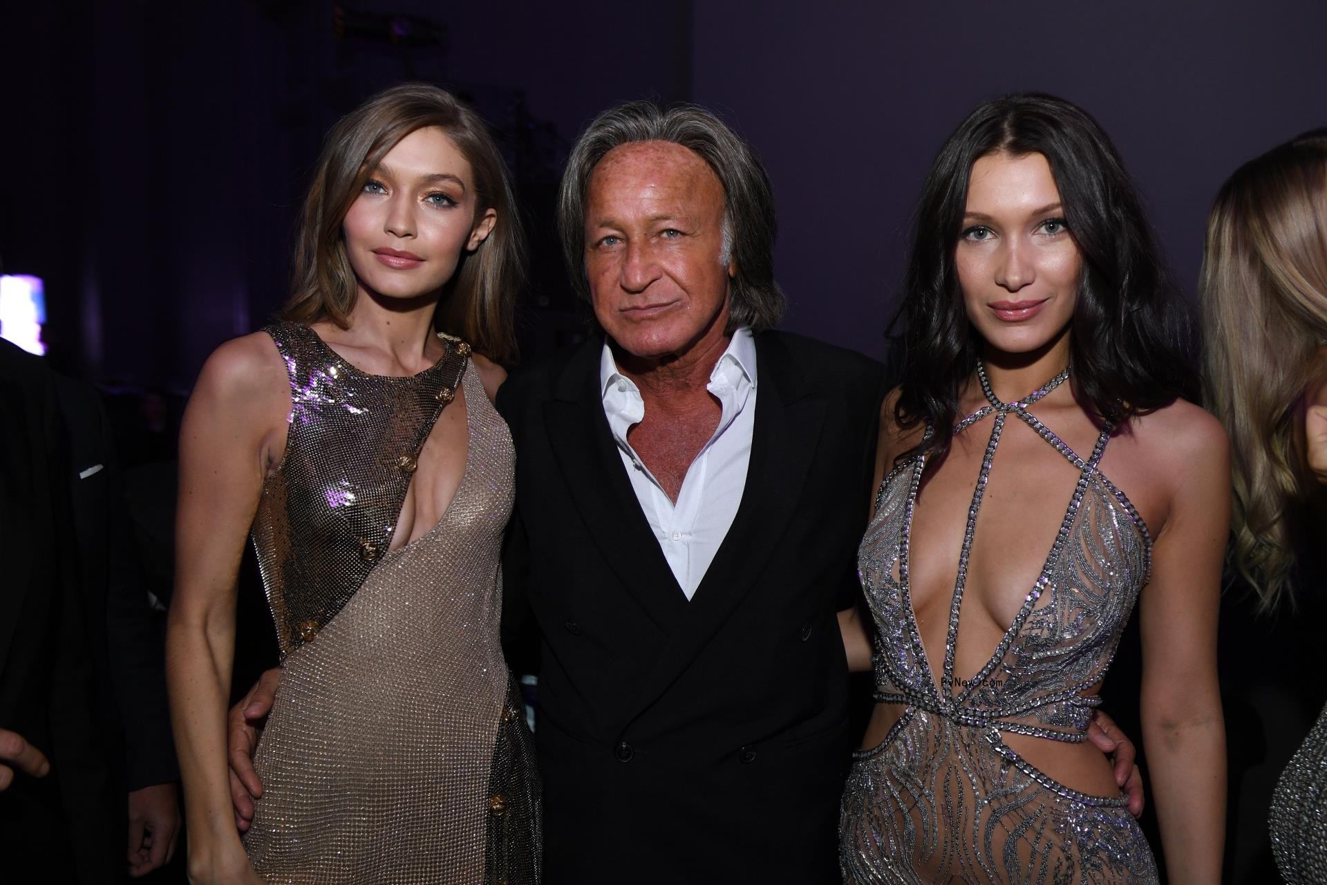 Mohamed Hadid stands arm in arm with daughters Gigi Hadid and Bella Hadid.