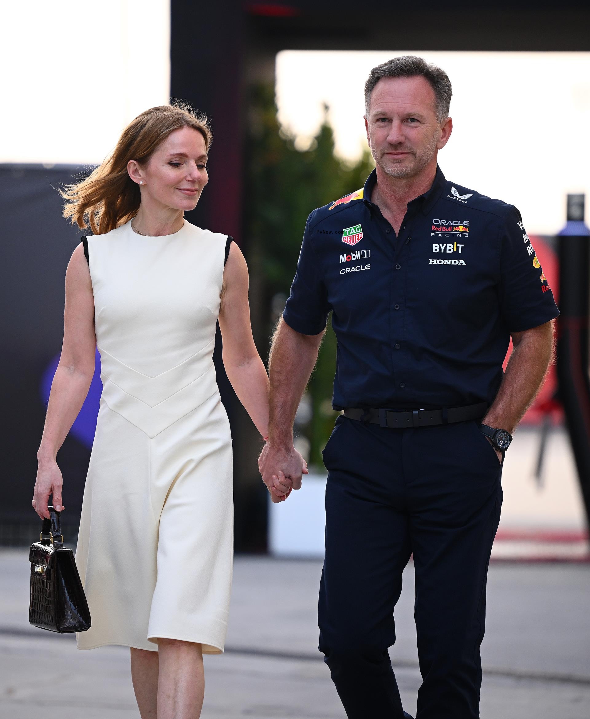 Geri Halliwell and Christian Horner holding hands.