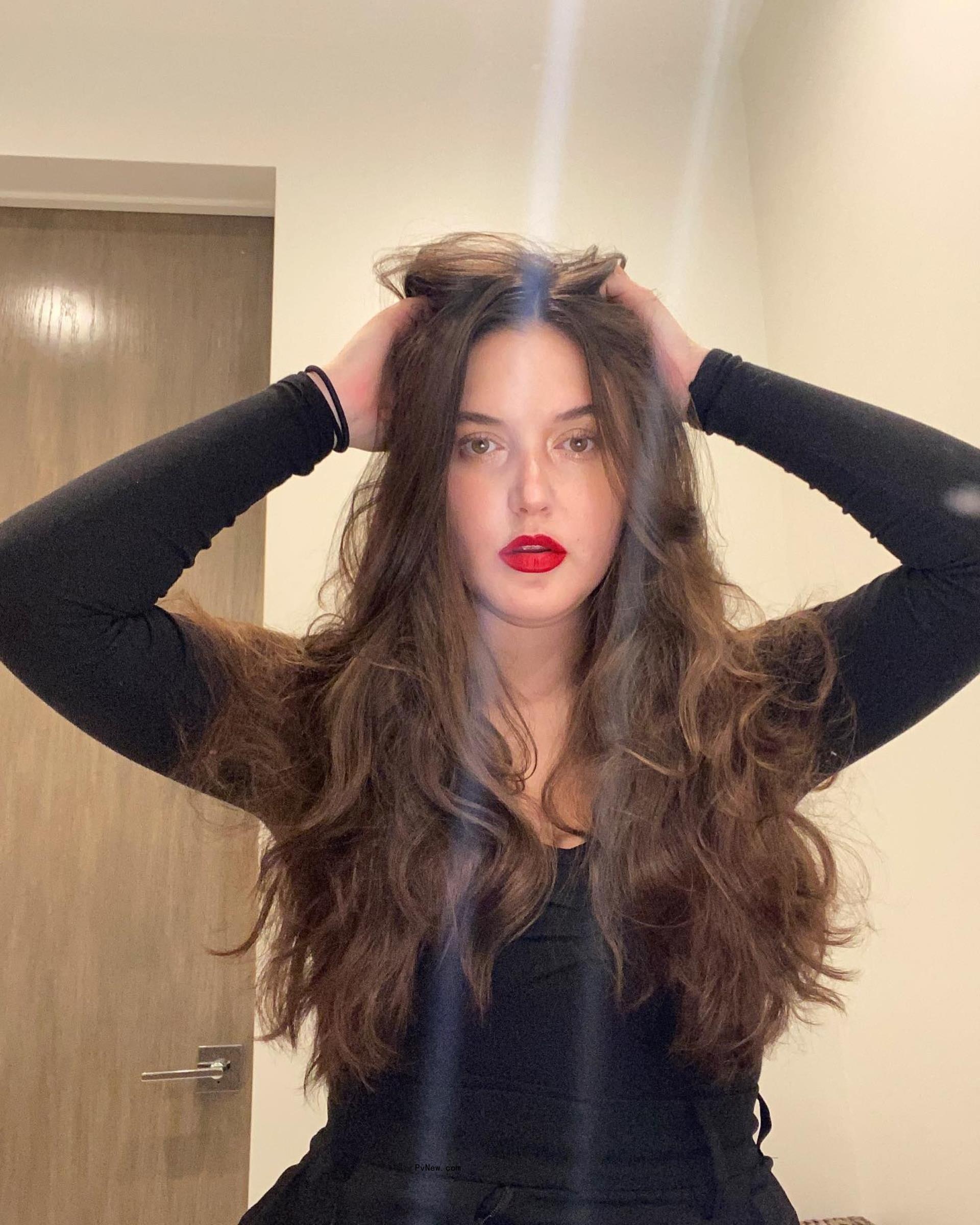 alaia baldwin touching her hair
