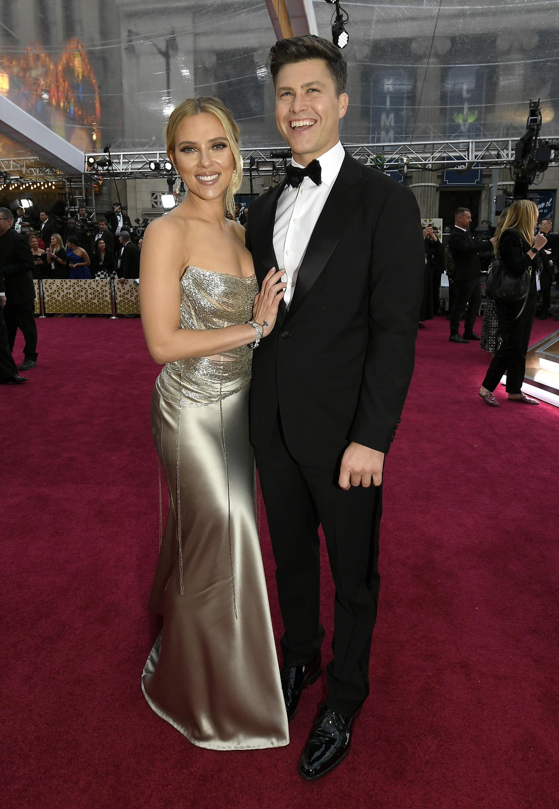 Colin Jost and Scarlett Johannson on a red carpet