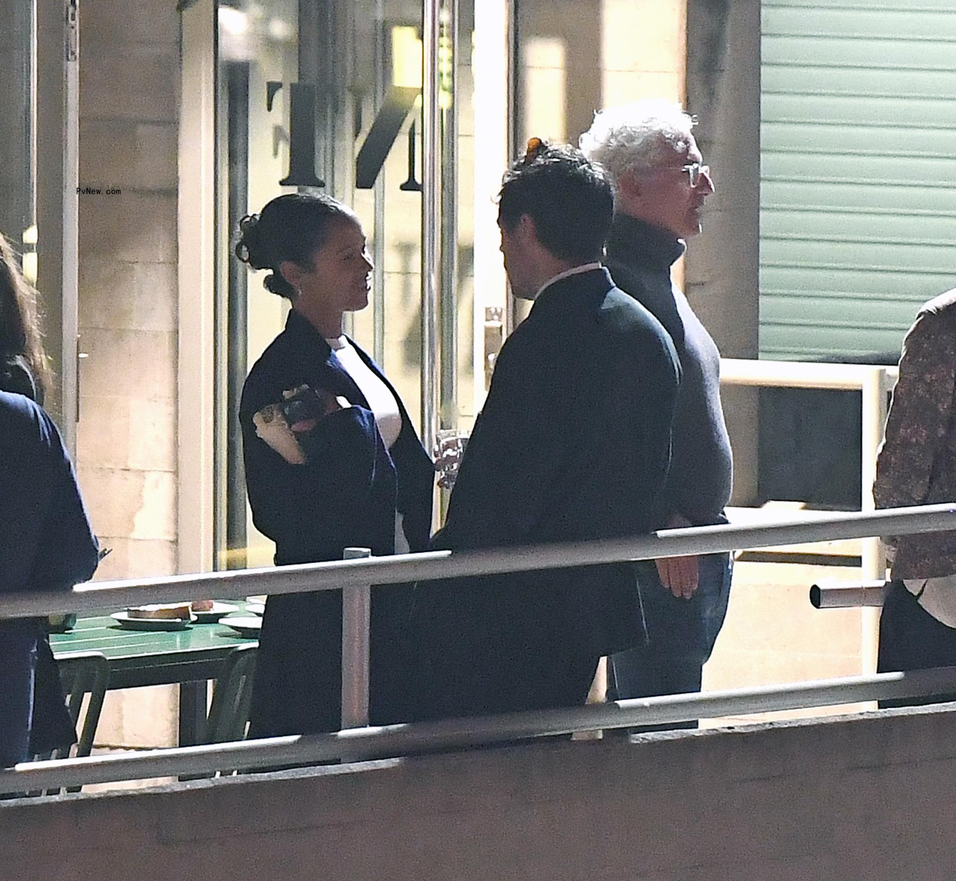 Harry Styles and Taylor Russell talking in London.