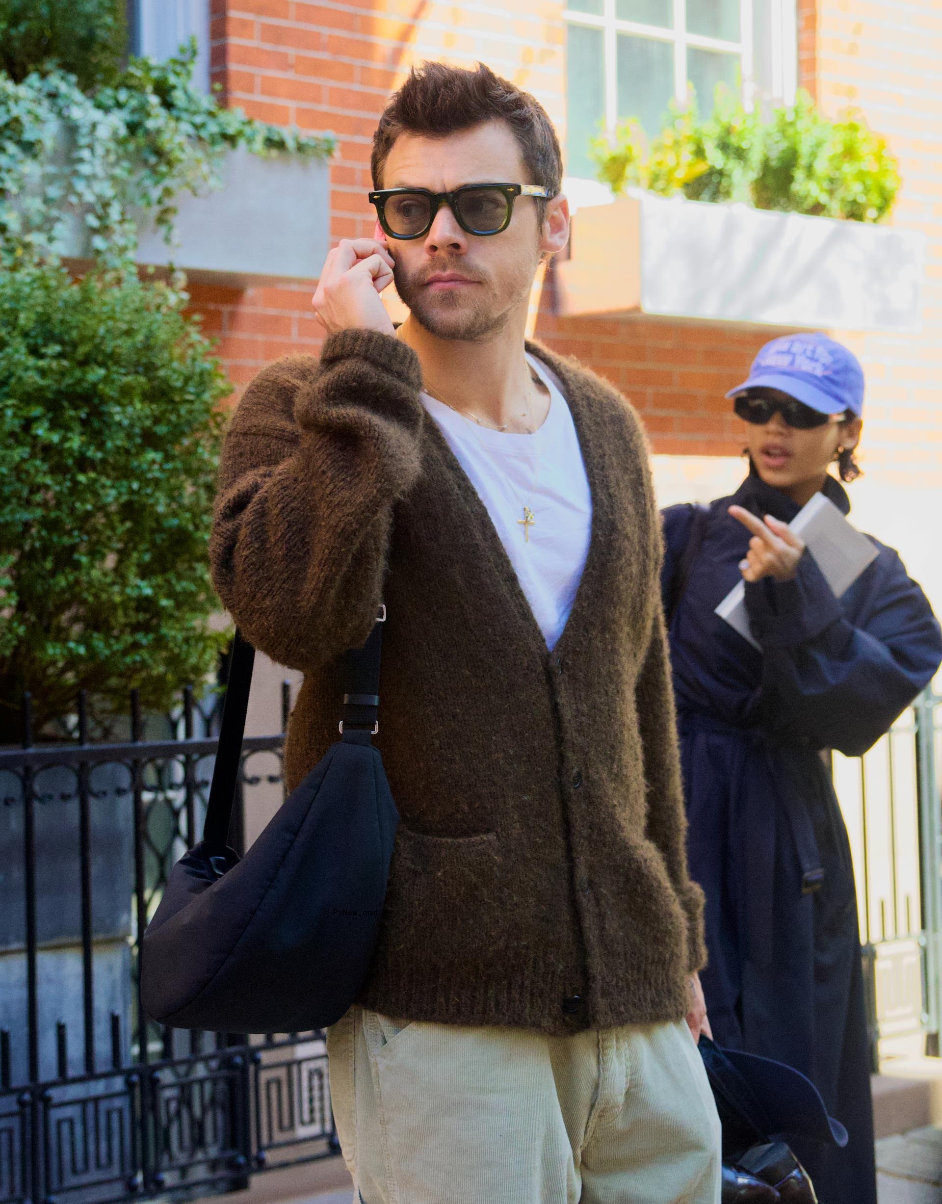Harry Styles and Taylor Russell walking in New York City.