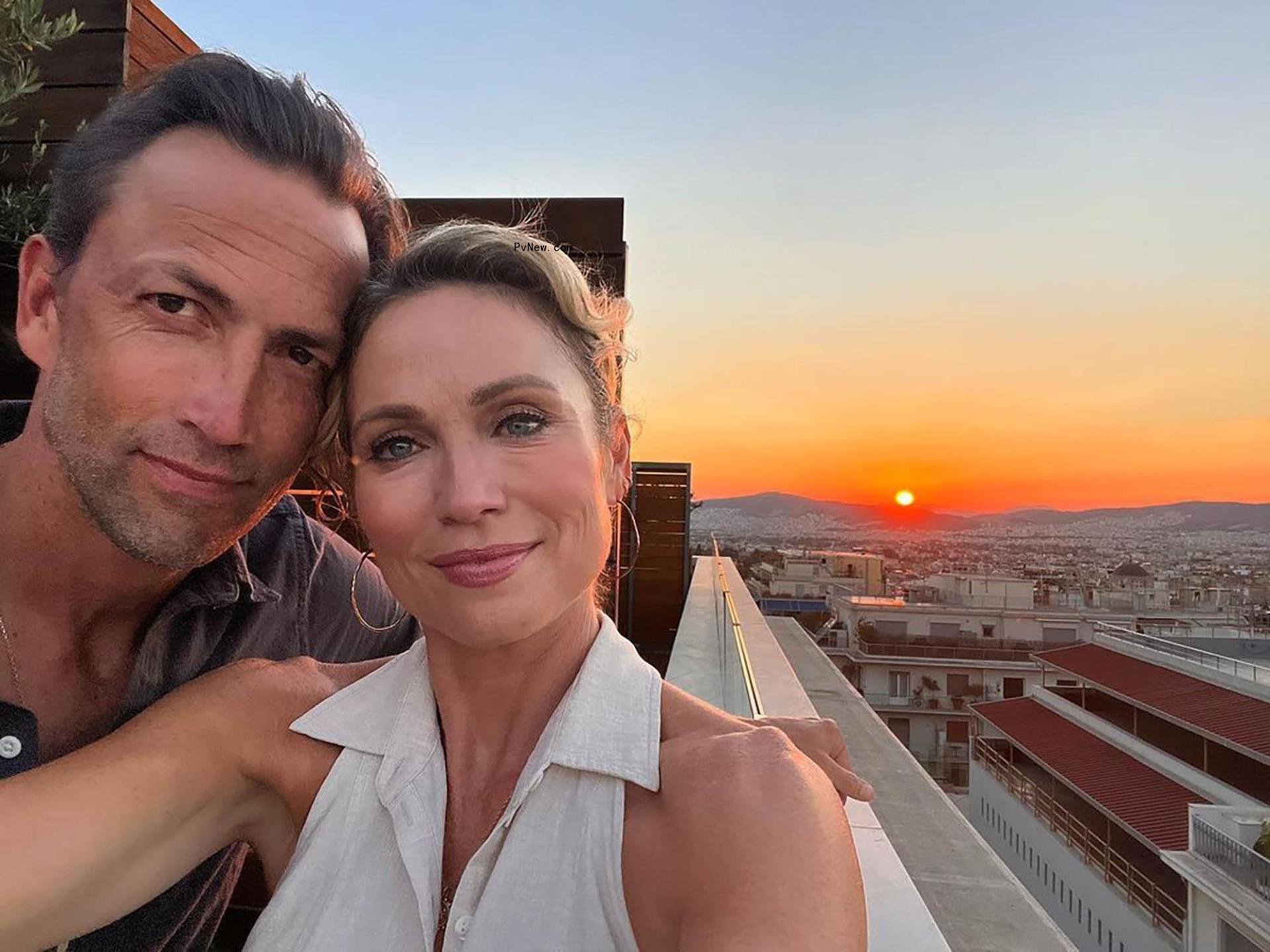 amy robach and andrew shue selfie in front of a sunset