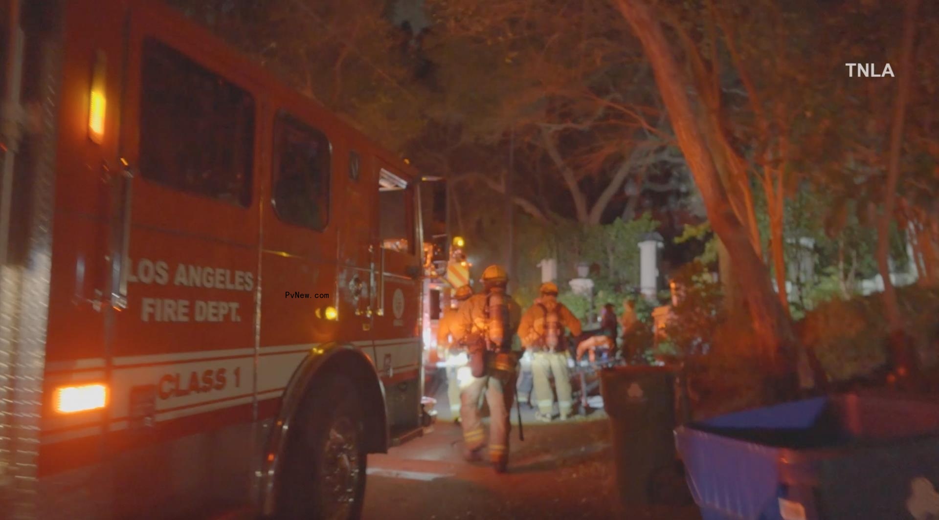 Firefighters outside of Cara Delevingne's home.
