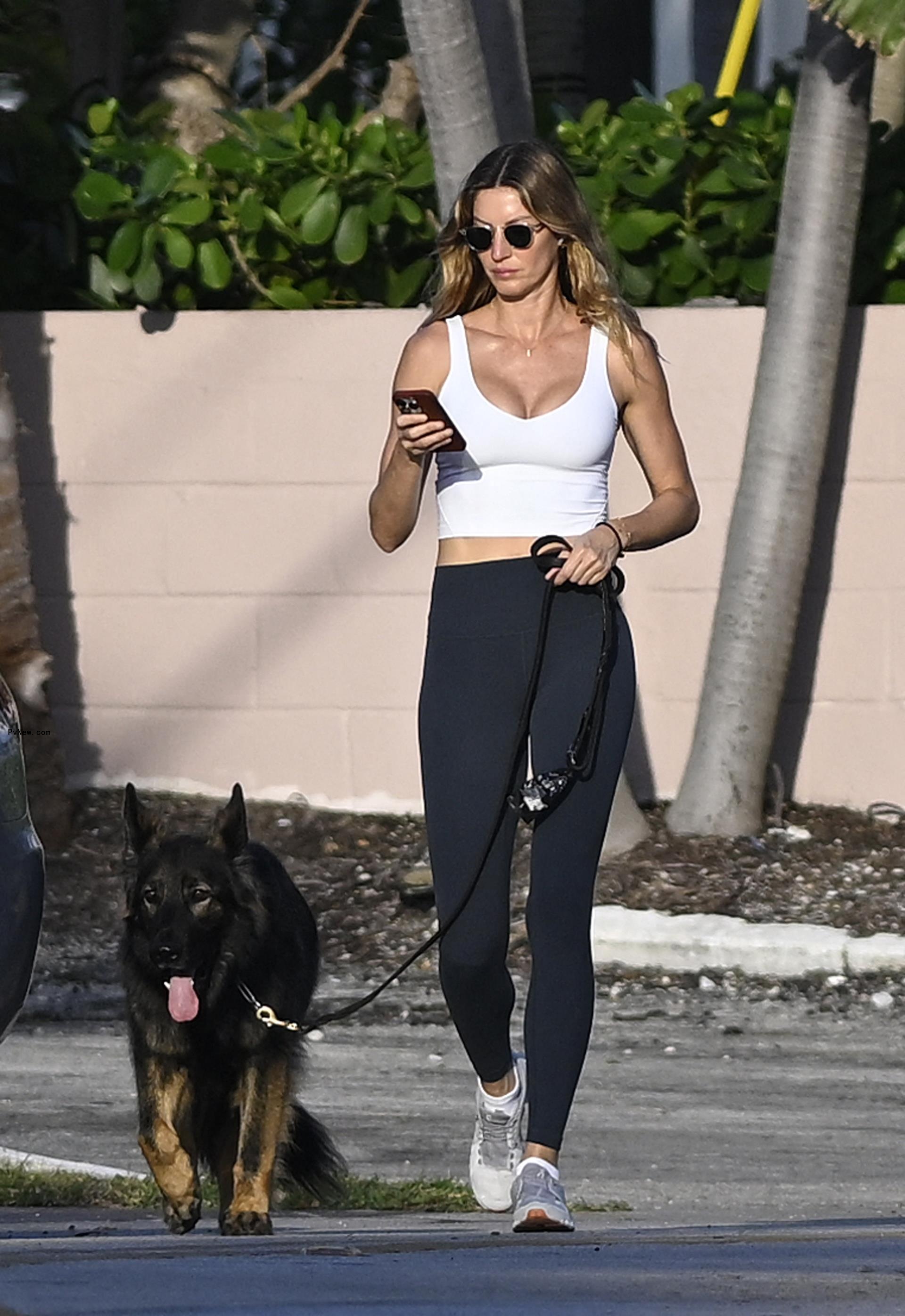 Gisele Bündchen walking her dog.