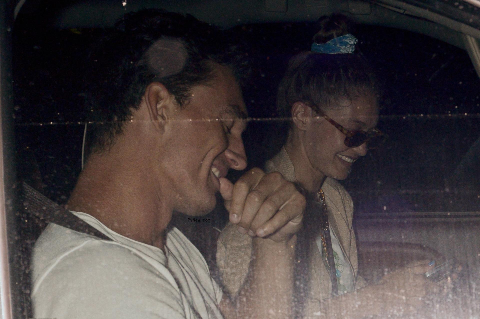 Gigi Hadid and Tyler Cameron sitting together 