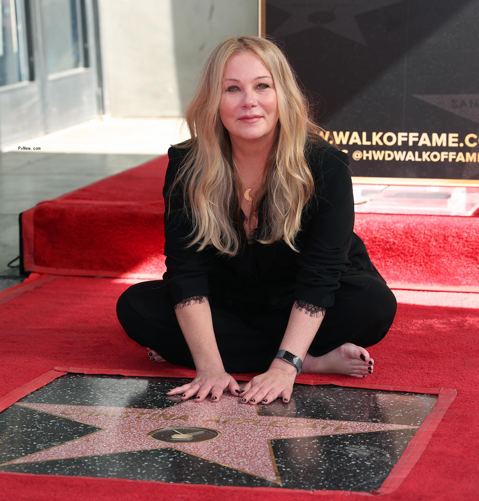 christina applegate sitting on her walk of fame star