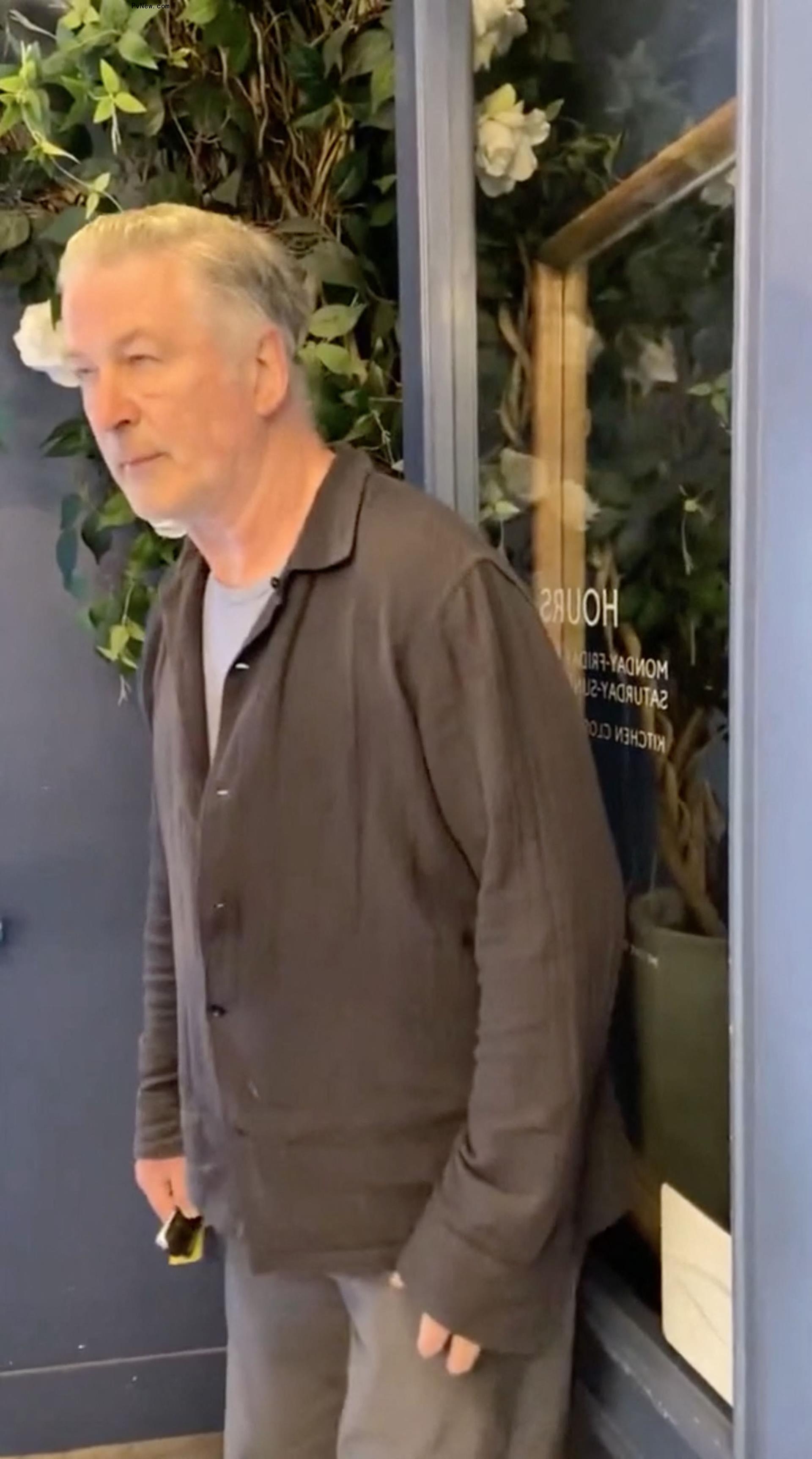 alec baldwin tussling with a woman