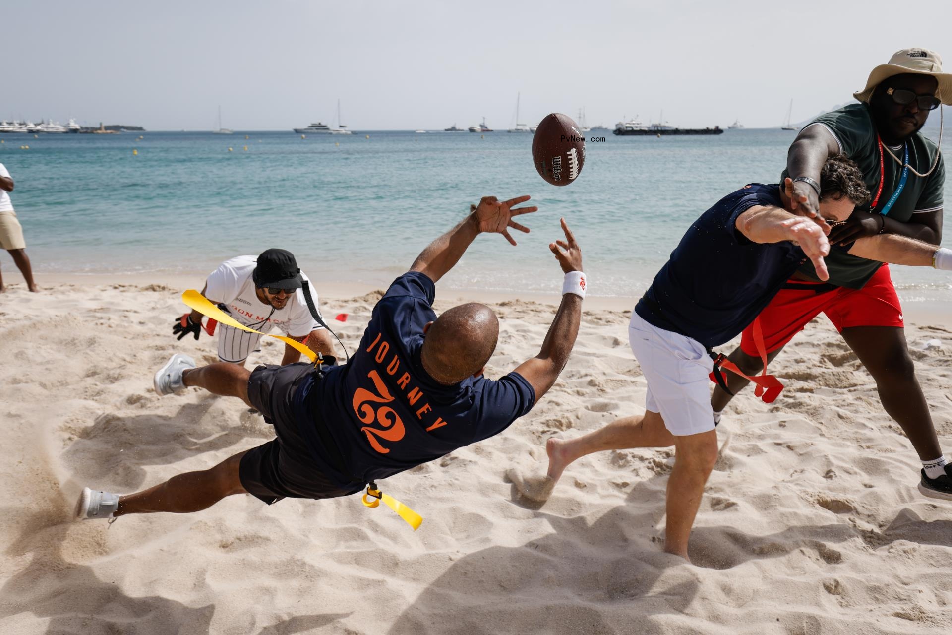 Damaune Journey catching a football on the beach