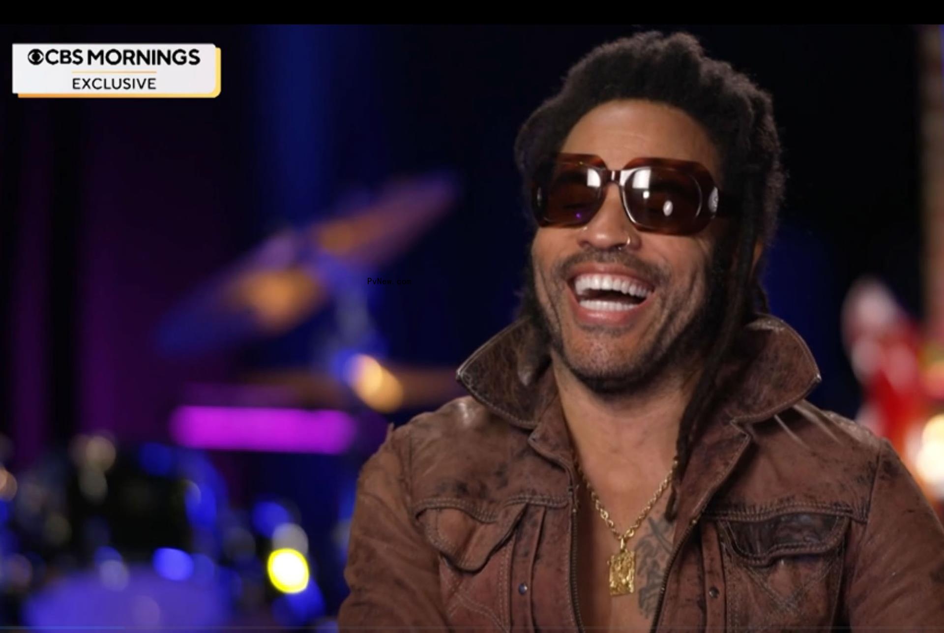 Lenny Kravitz laughing.