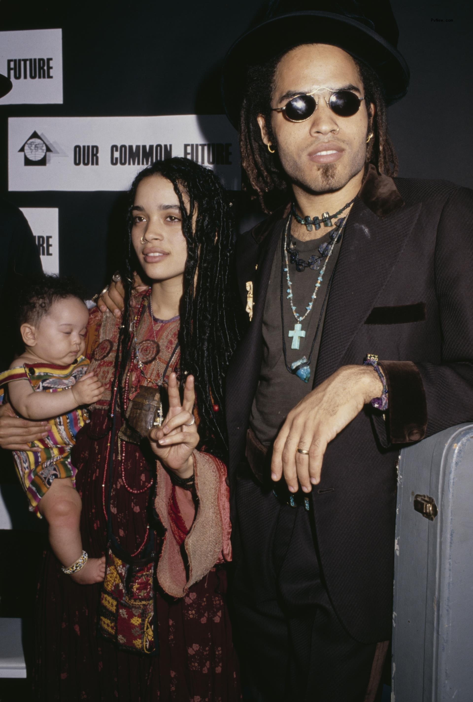 Lenny Kravitz and Lisa Bo<i></i>net posing together while she holds a baby Zoë Kravitz.