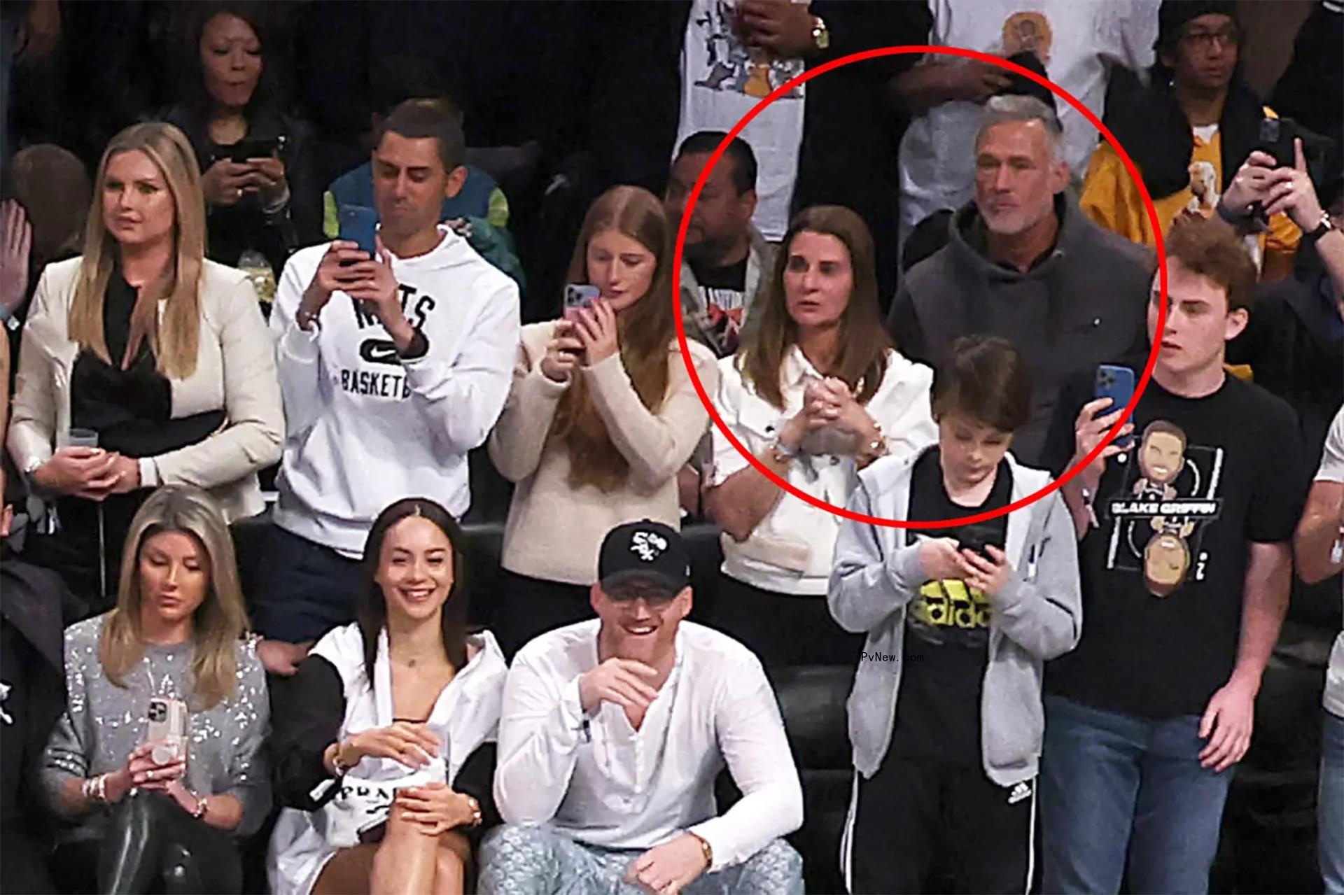 melinda gates and jon du pre standing in a crowd