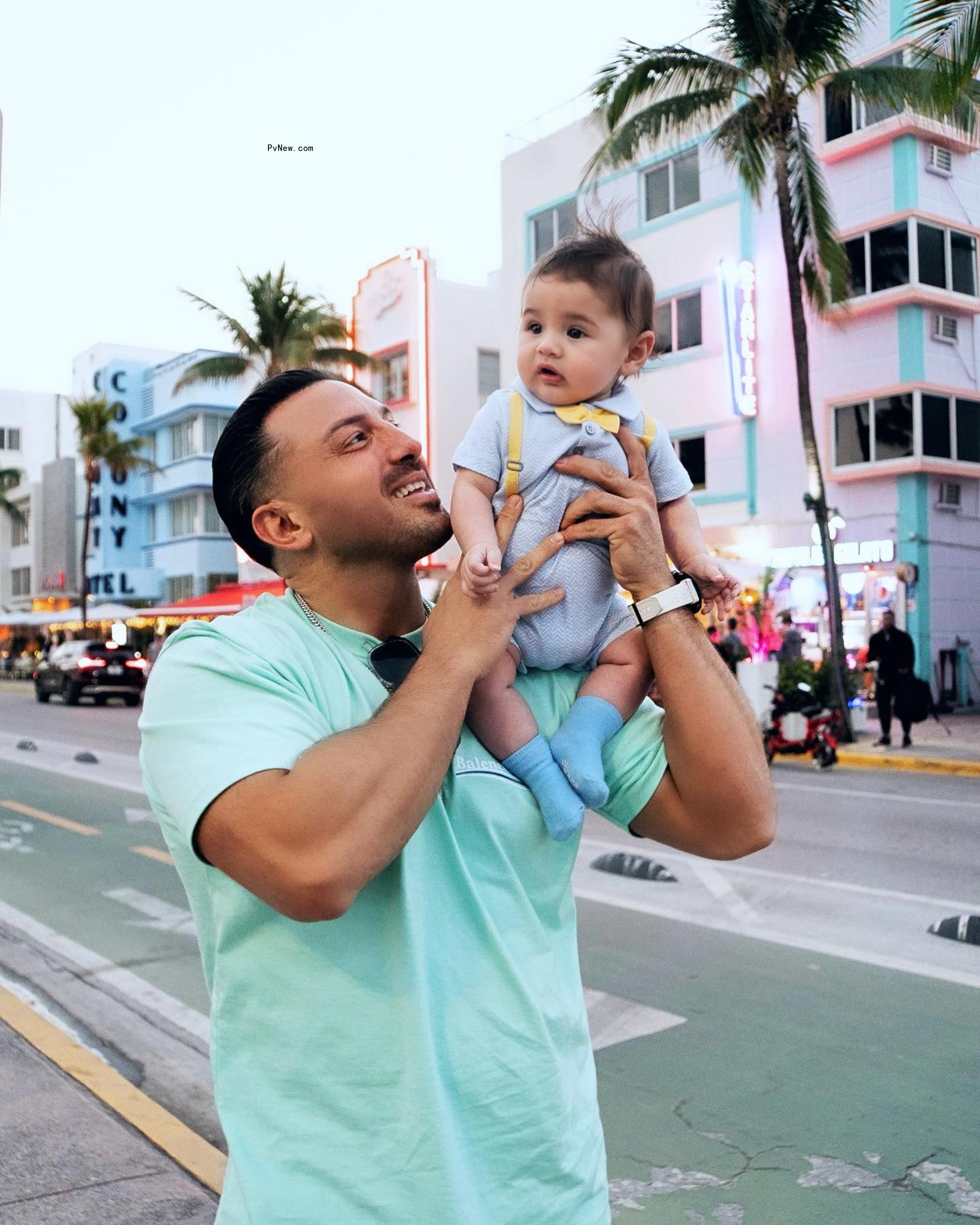 joe ambrosole holding up his son jayden