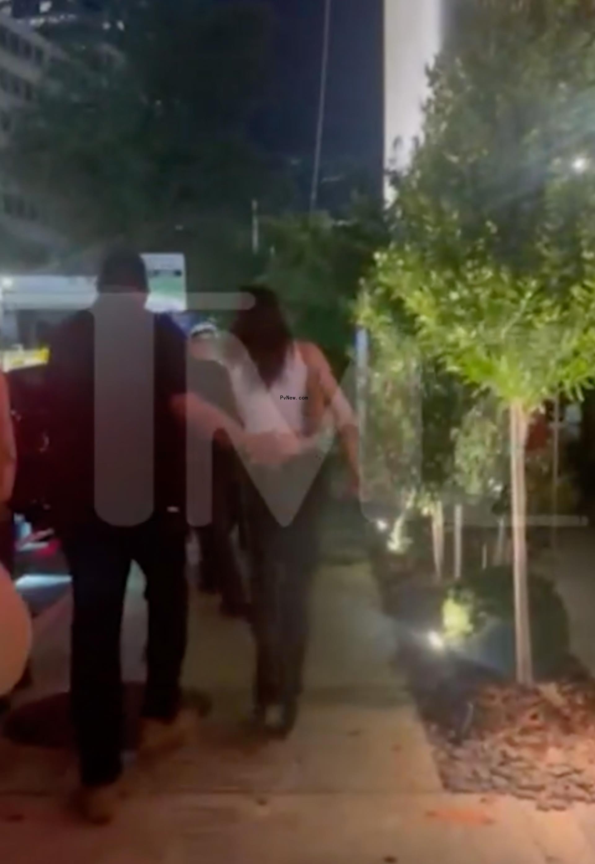 Kendall Jenner and Bad Bunny exiting a restaurant in Miami