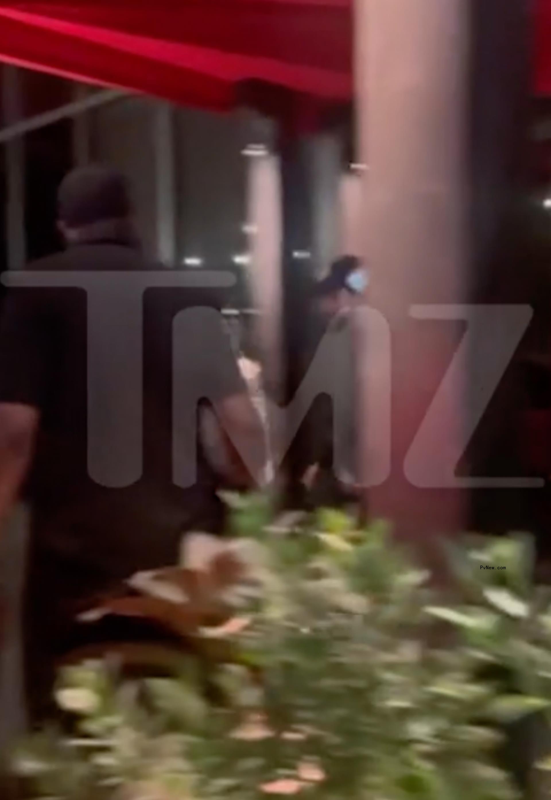 Kendall Jenner and Bad Bunny exiting a restaurant in Miami