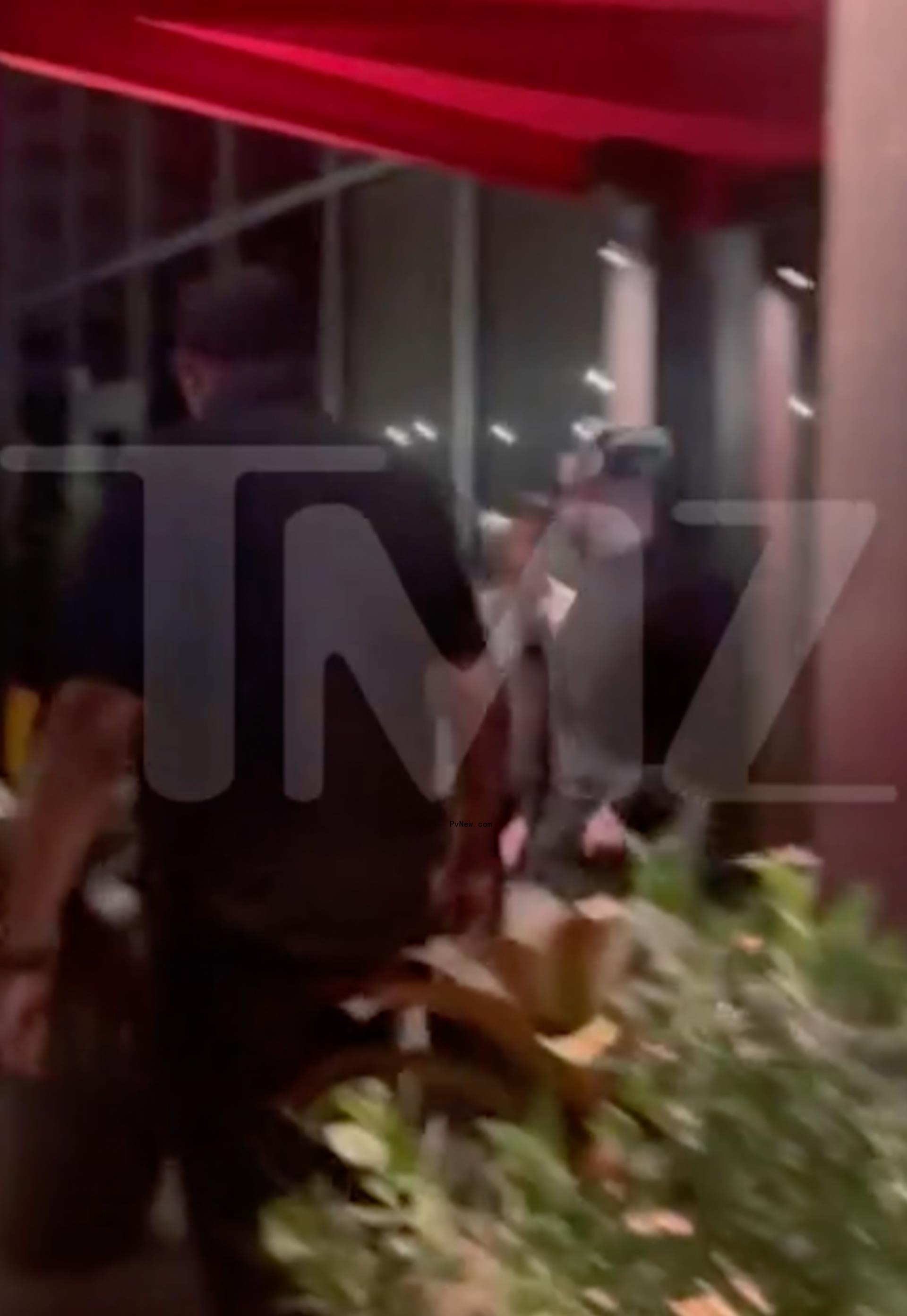 Kendall Jenner and Bad Bunny exiting a restaurant in Miami