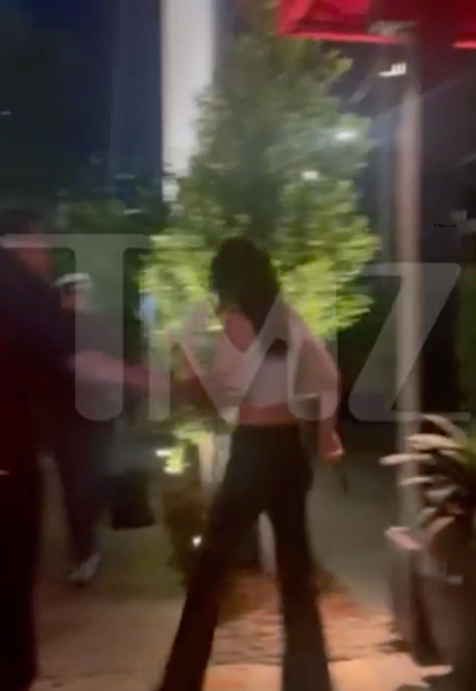 Kendall Jenner and Bad Bunny exiting a restaurant in Miami