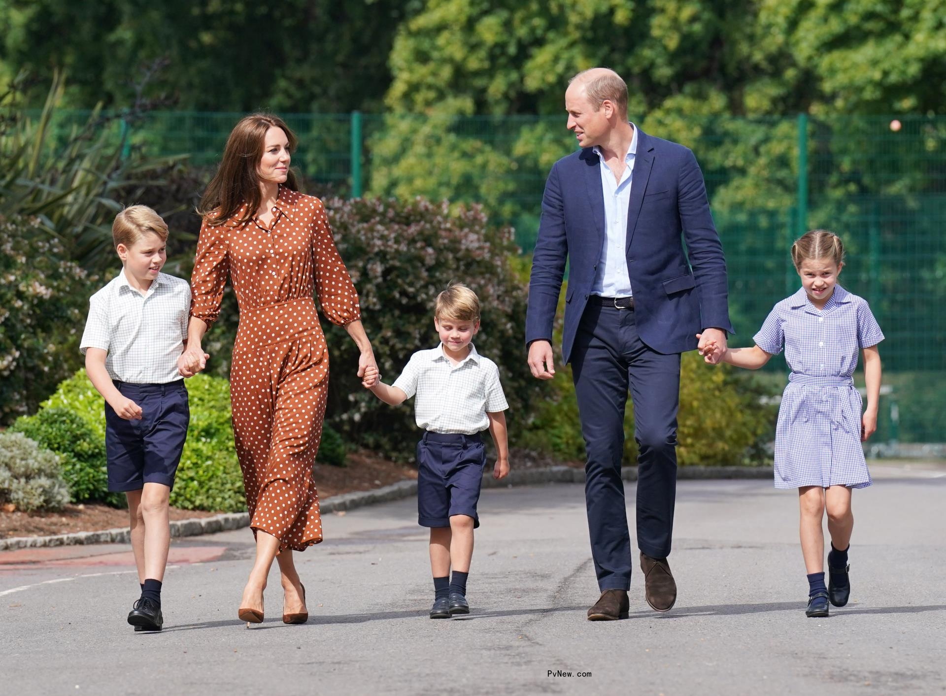 Kate Middleton and Prince William walking with their kids.