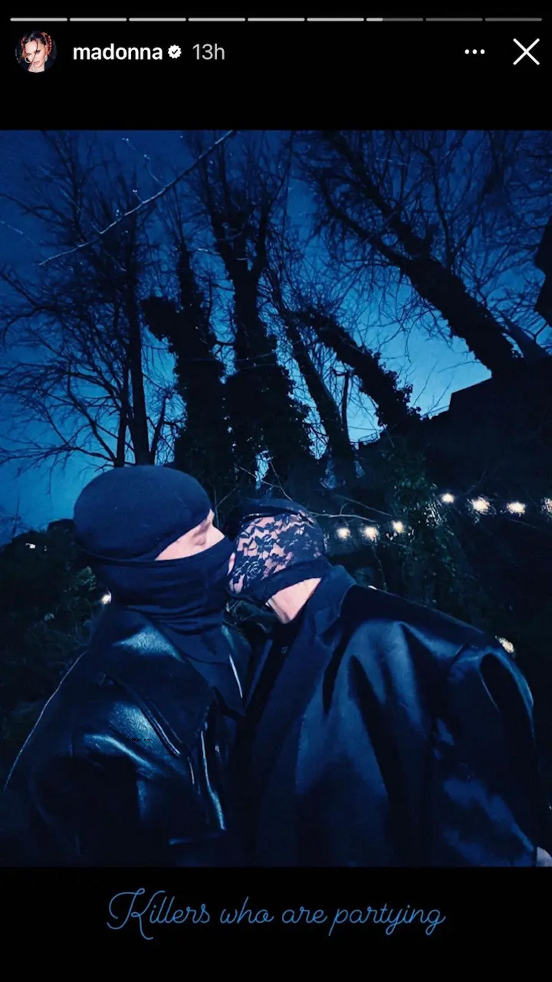 Josh Popper and Mado<i></i>nna kissing.