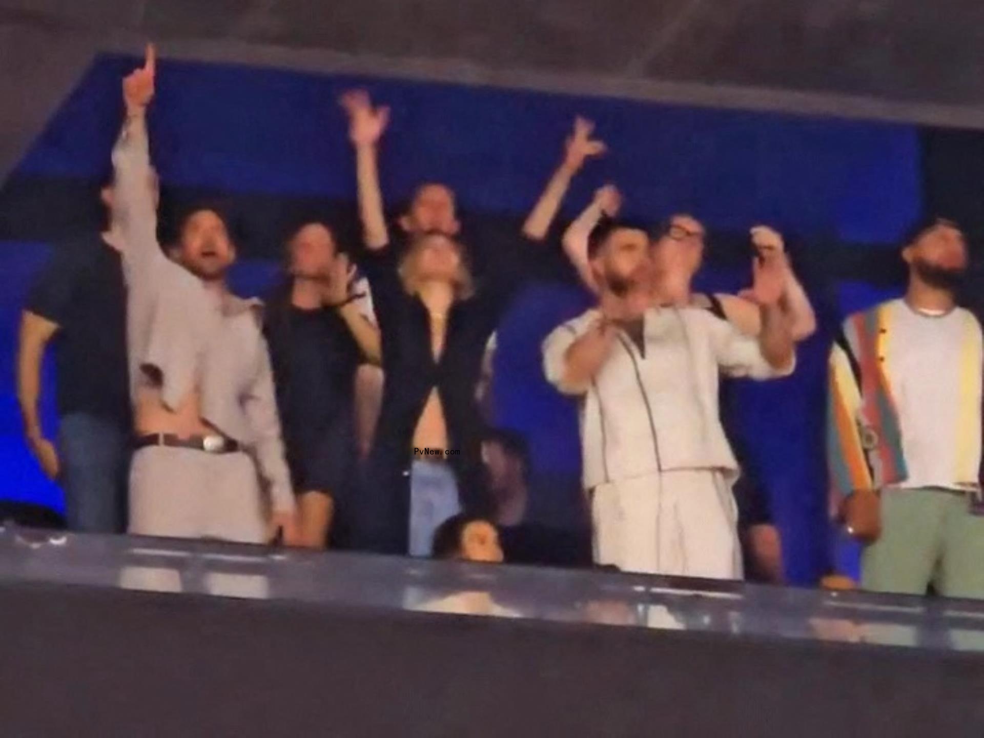 Travis Kelce, Gigi Hadid and Bradley Cooper at a Taylor Swift concert.