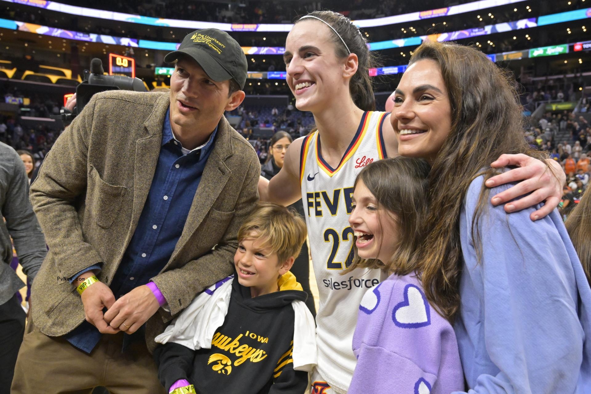 Mila Kunis and Ashton Kutcher with their kids, Wyatt and Dimitri, and Caitlin Clark