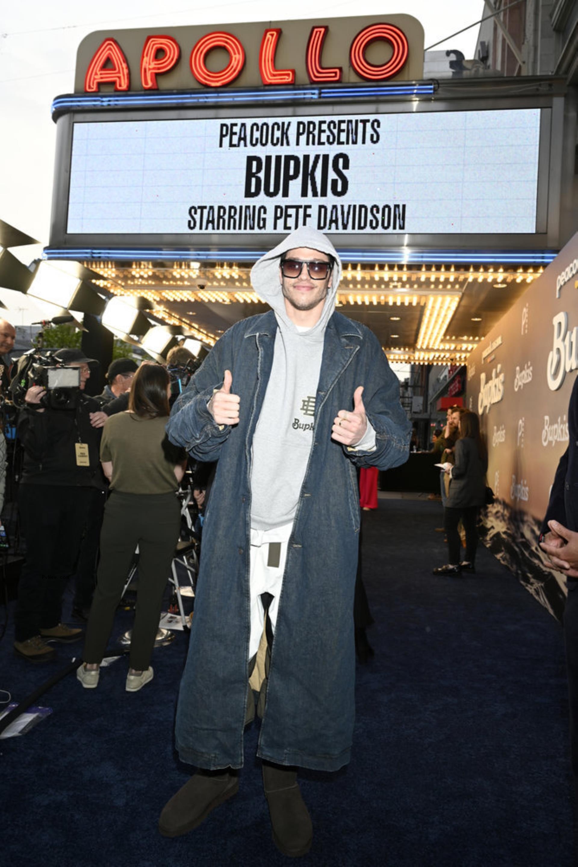 pete davidson giving thumbs up underneath Apollo Marquee