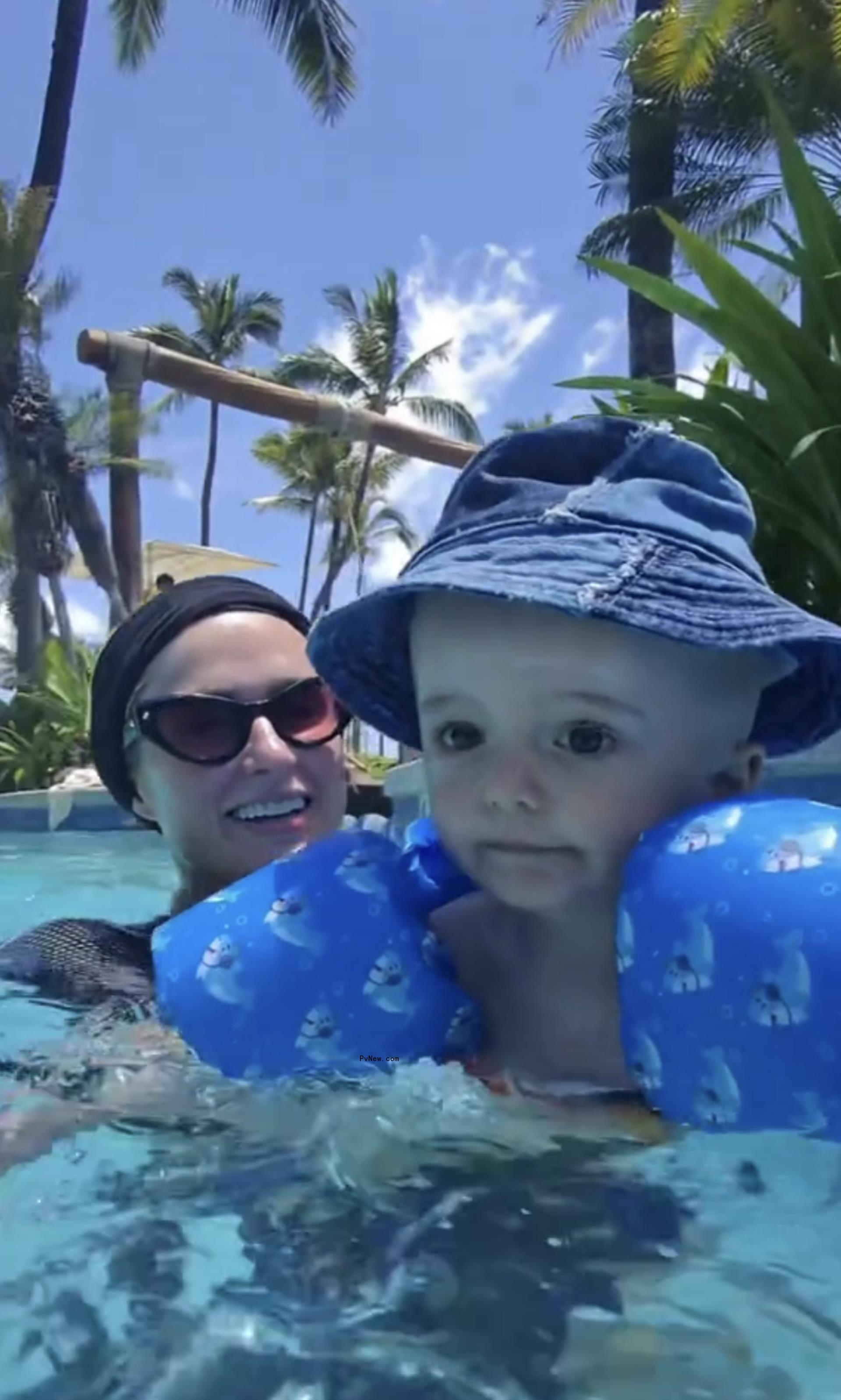 Paris Hilton swimming with her son, Phoenix.