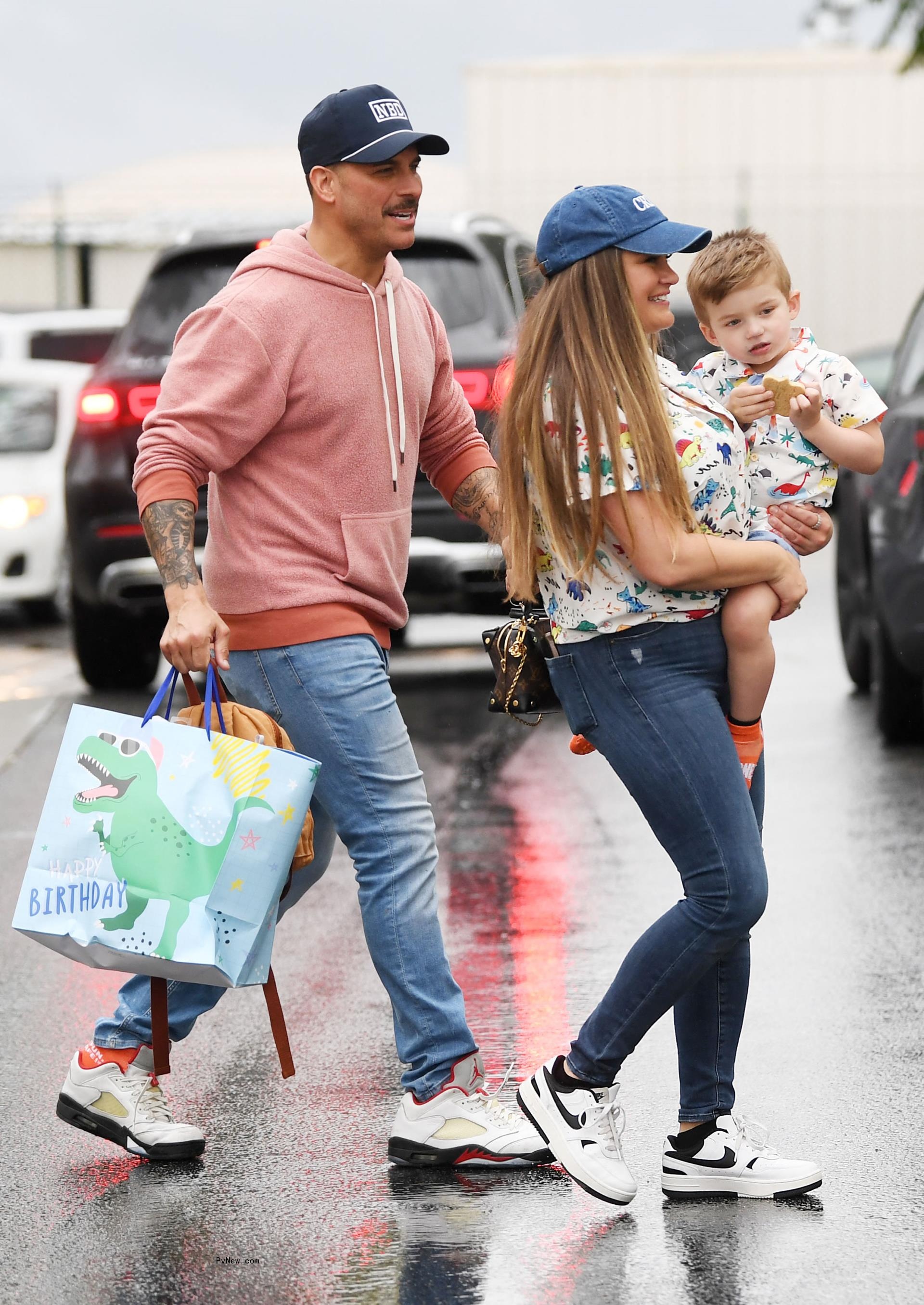 Jax Taylor and Brittany Cartwright walking with their son, Cruz