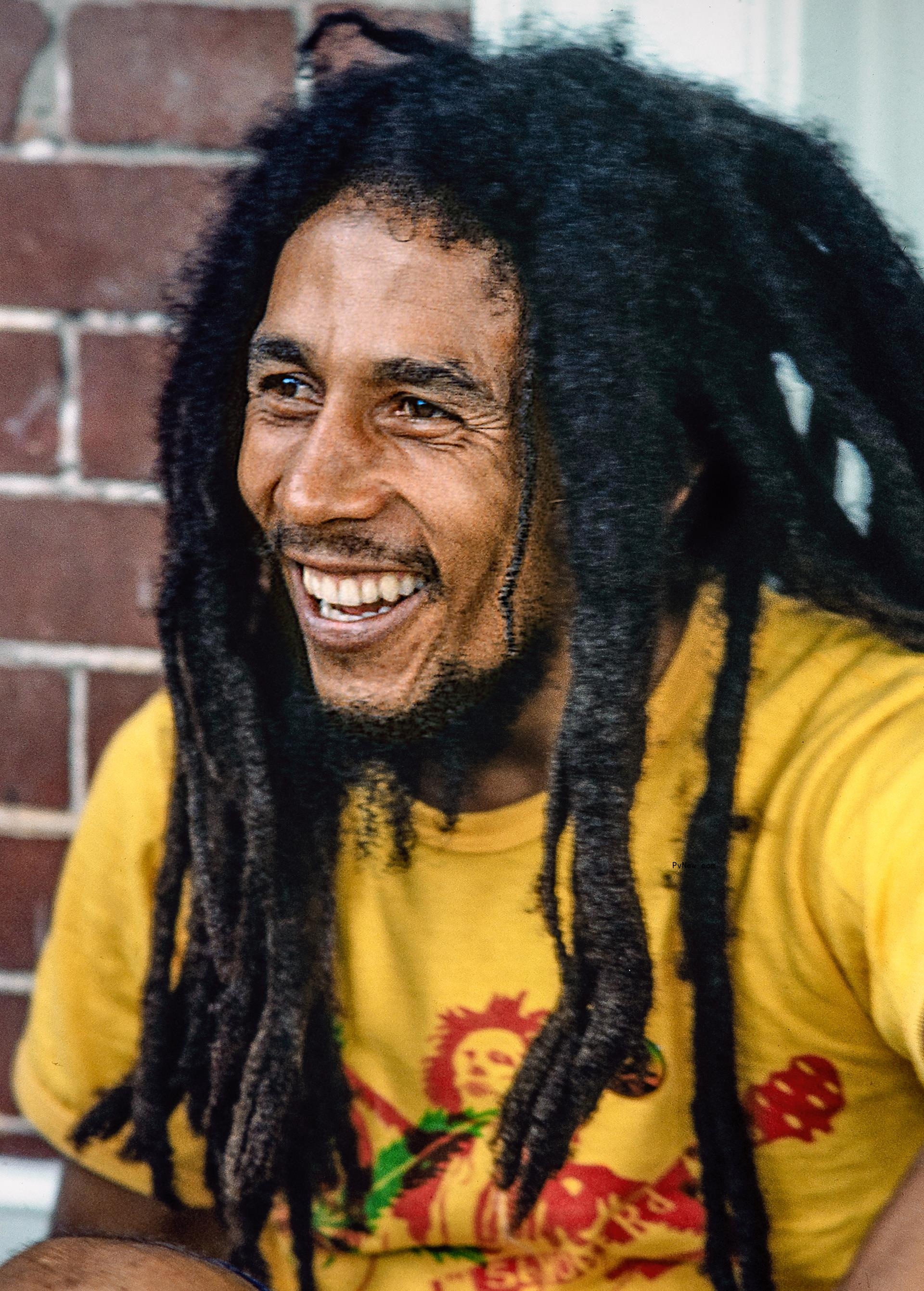 Bob Marley smiling in Jamaica.