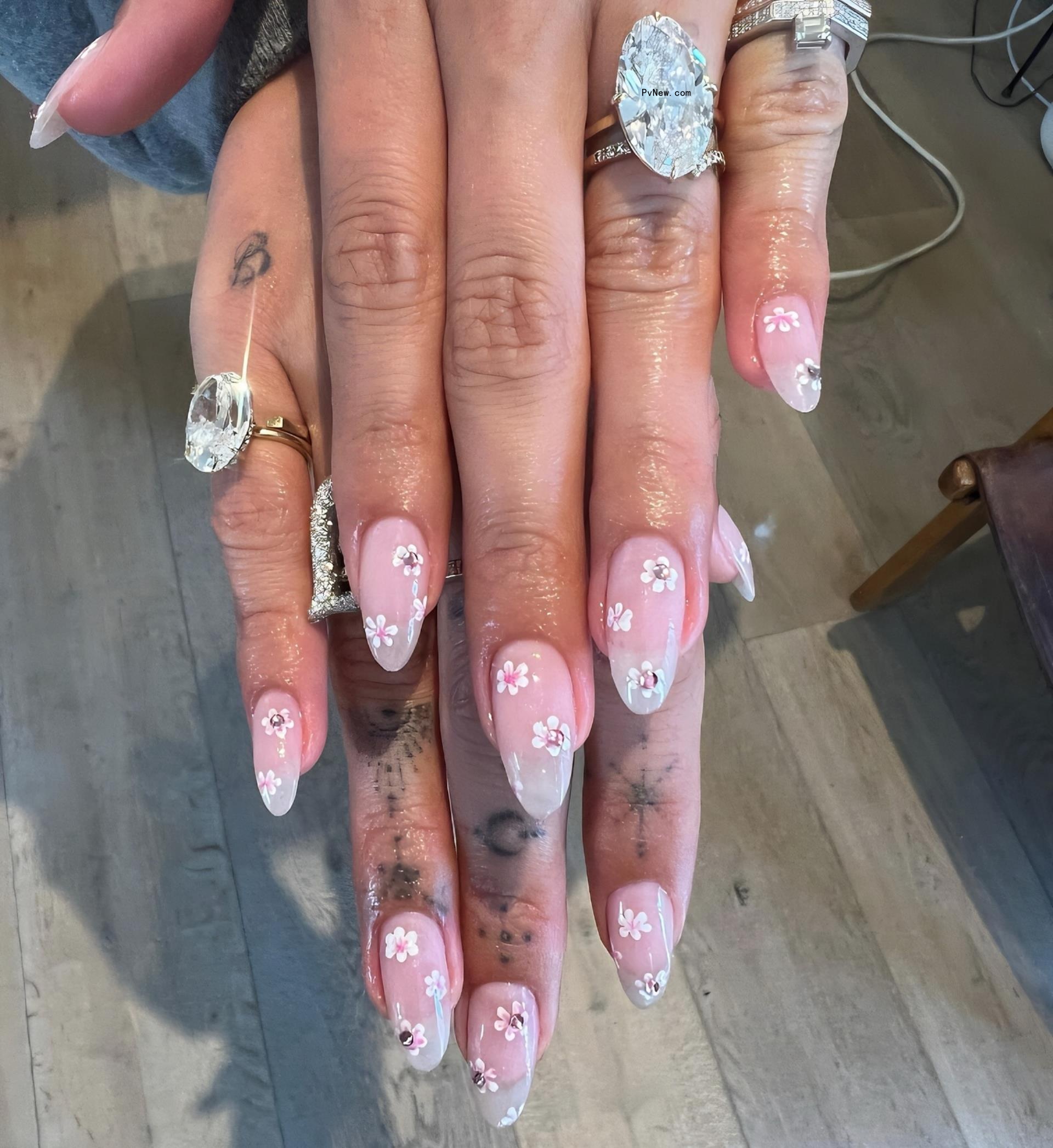 Hailey Bieber's new ring on her hands. 