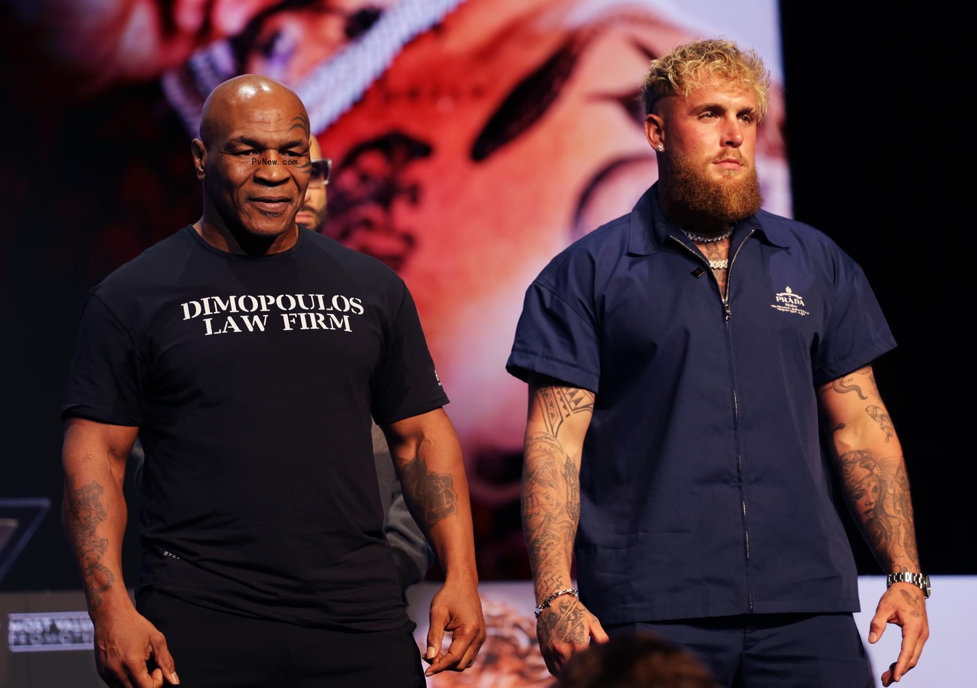 Mike Tyson and Jake Paul at a press conference.