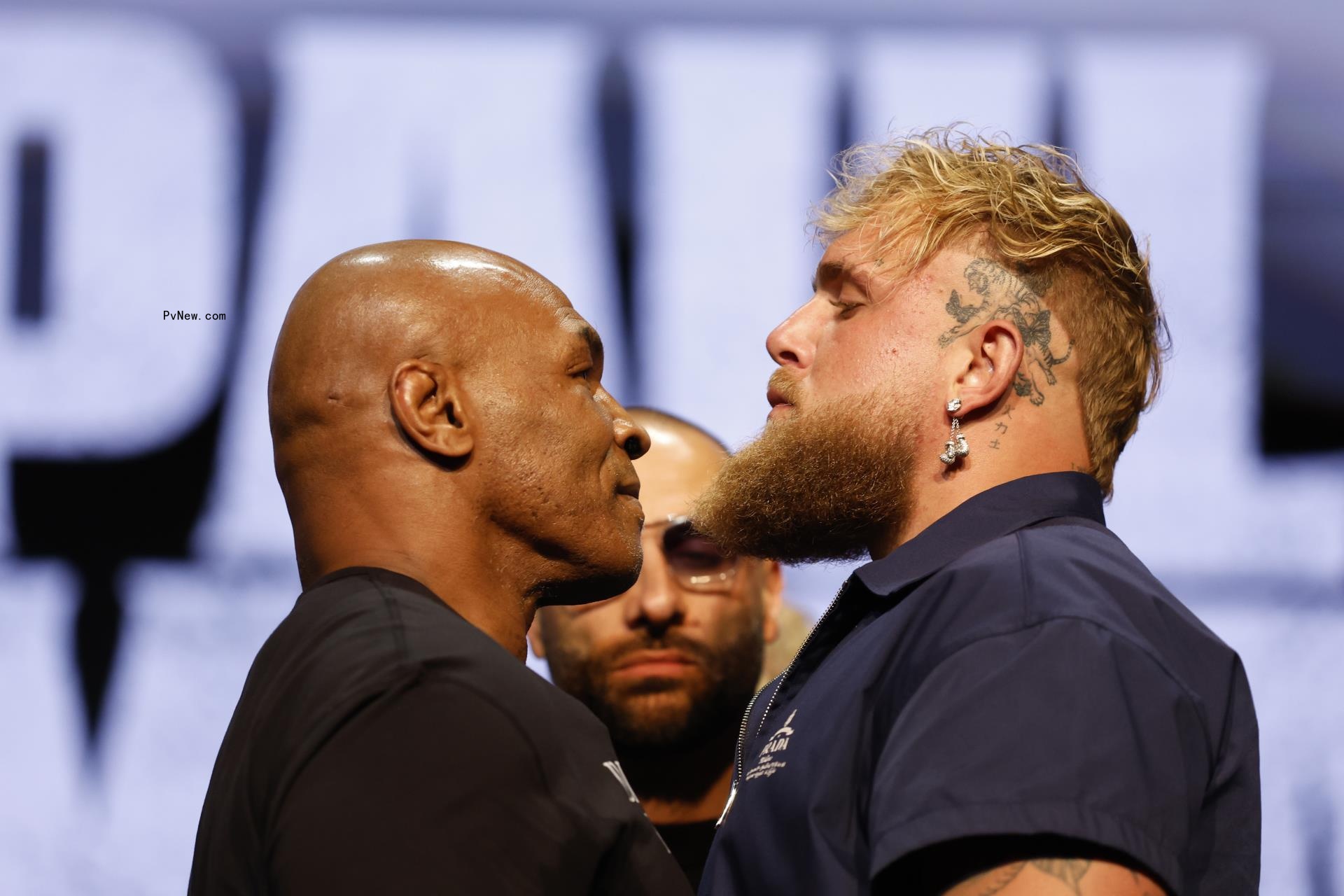Jake Paul and Mike Tyson at a press conference.
