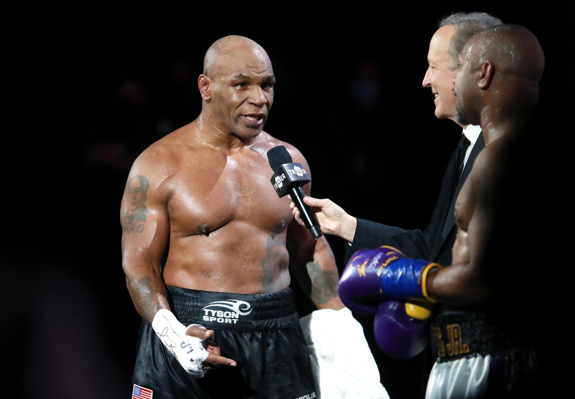 Mike Tyson in a boxing ring.