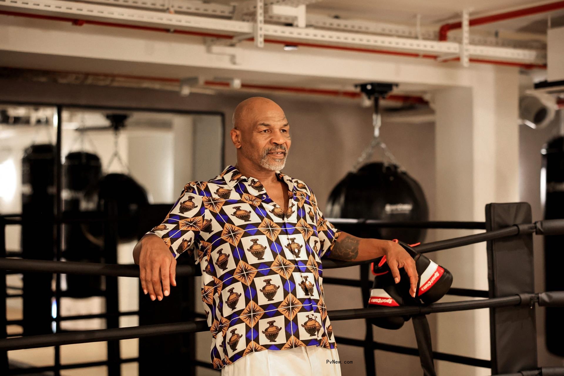 Mike Tyson in a boxing ring.