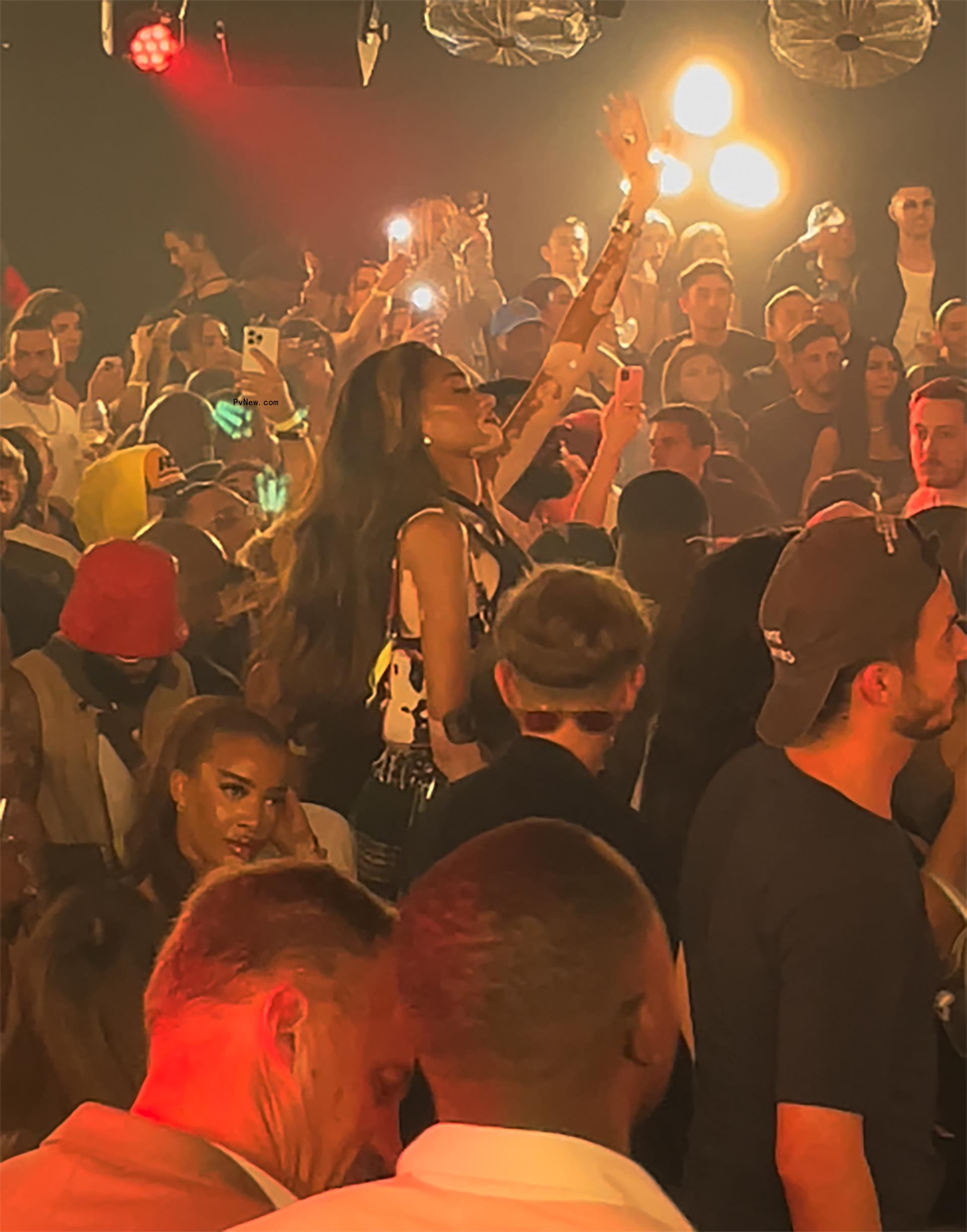 Winnie Harlow seeing Travis Scott perform.