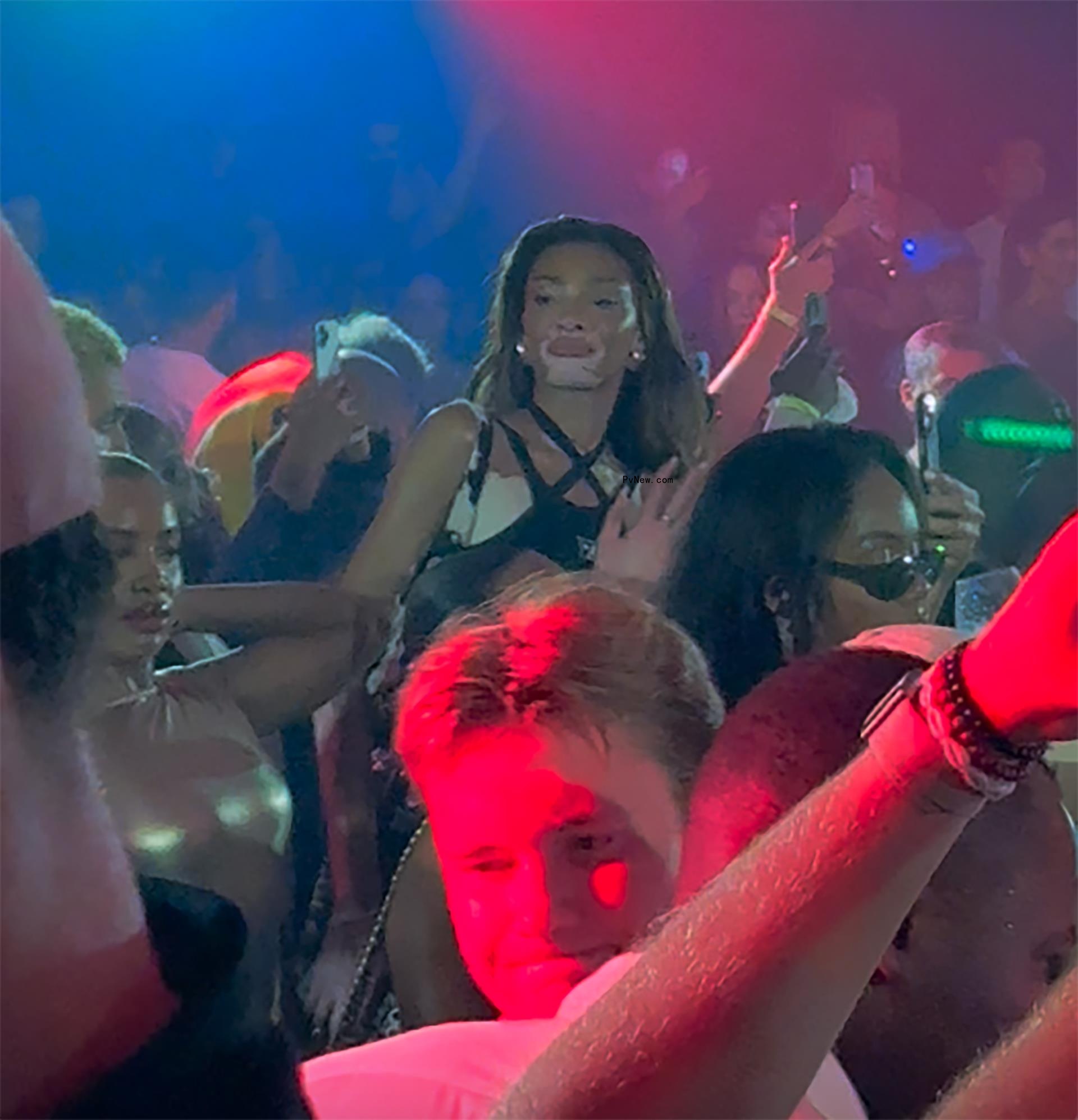 Winnie Harlow seeing Travis Scott perform.