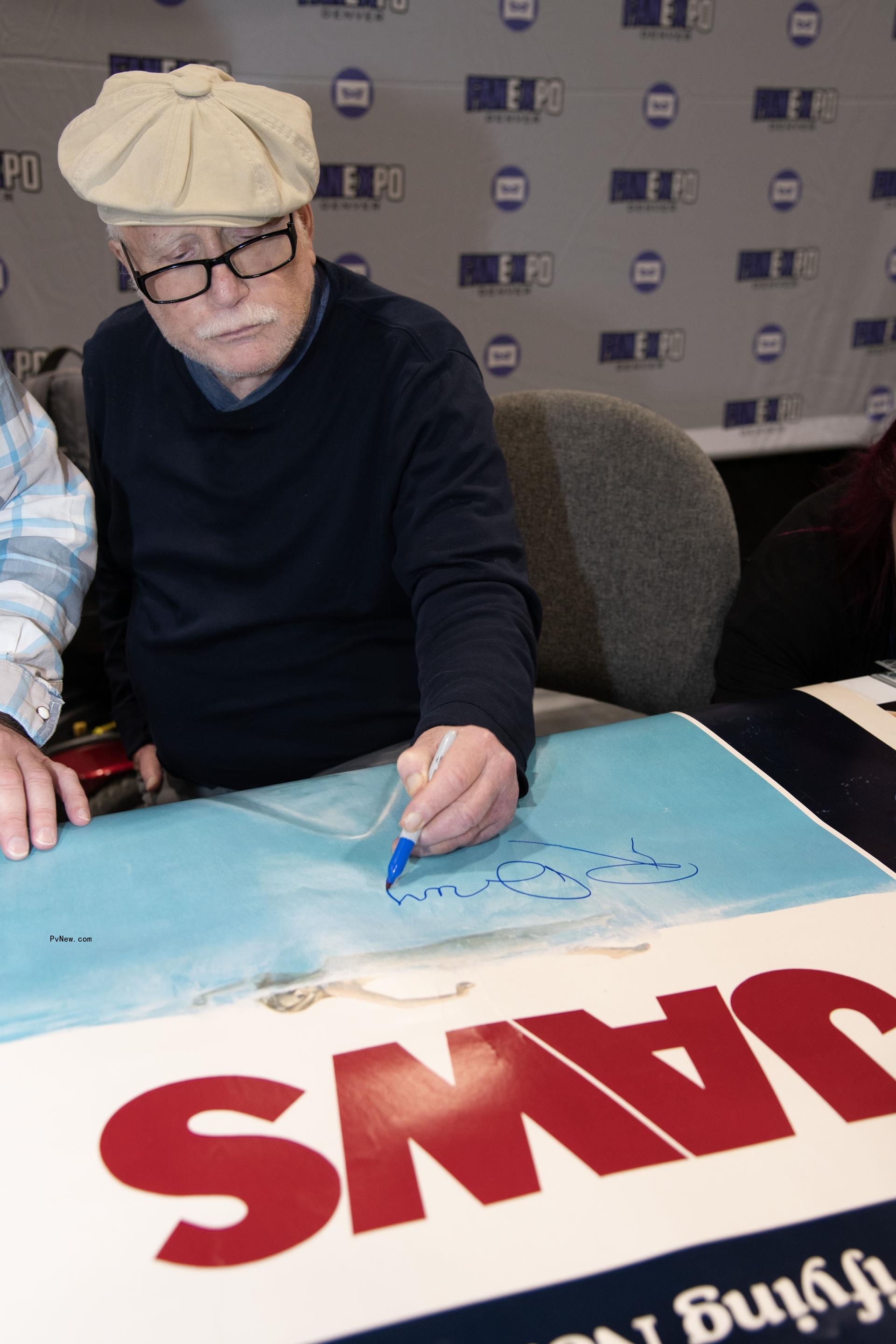 Richard Dreyfuss signing a 