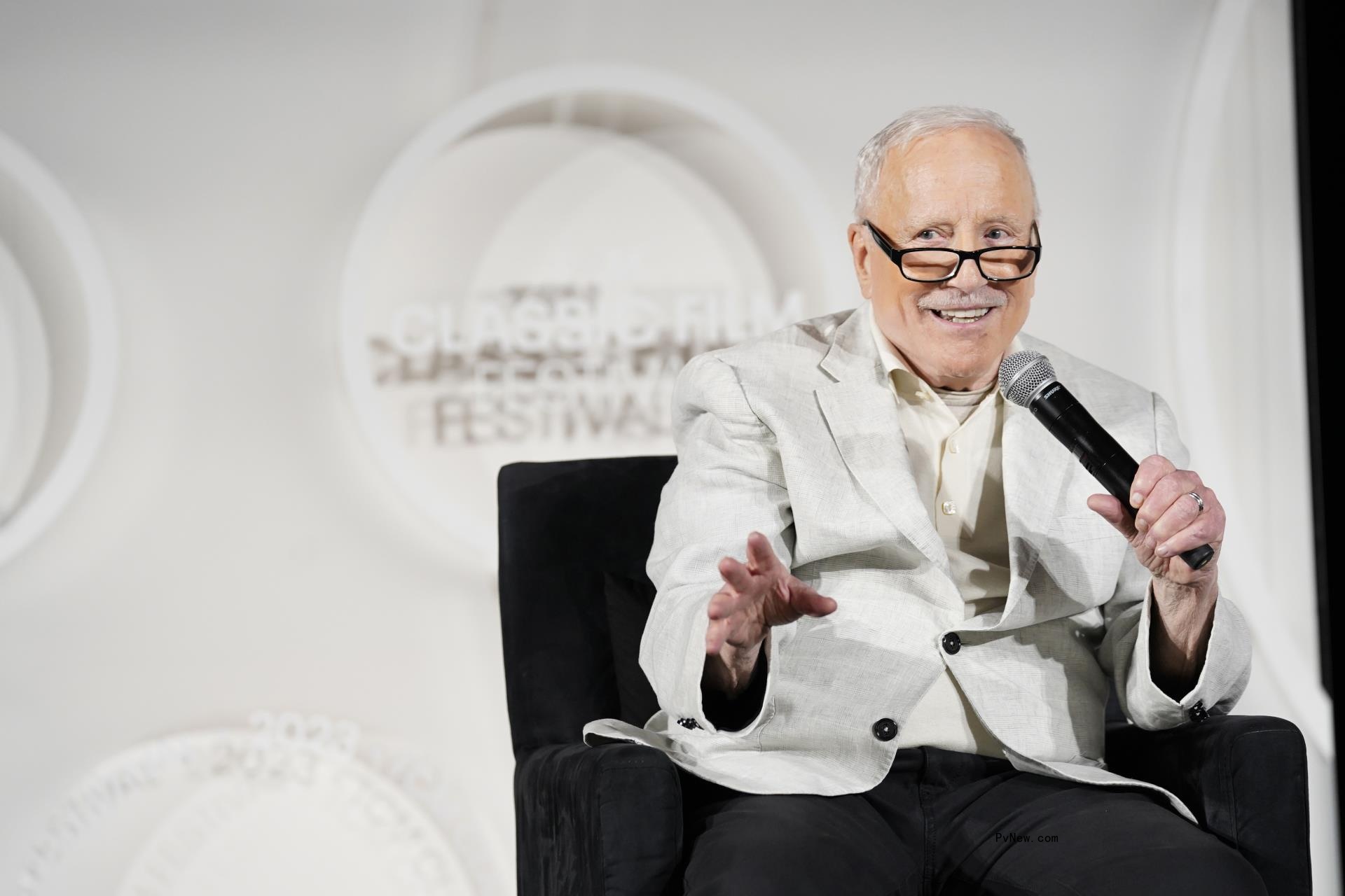 Richard Dreyfuss sitting