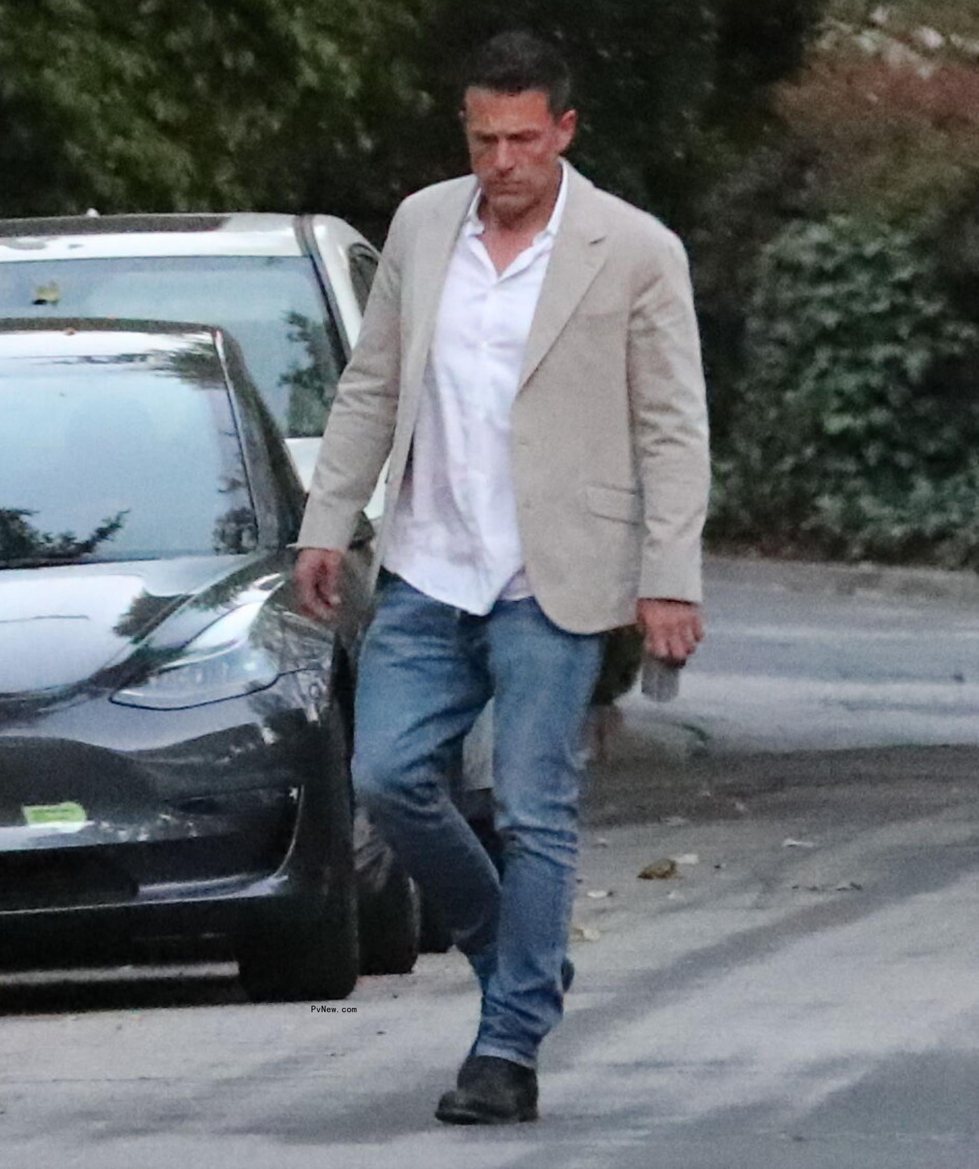 Ben Affleck going to his daughter's graduation party.