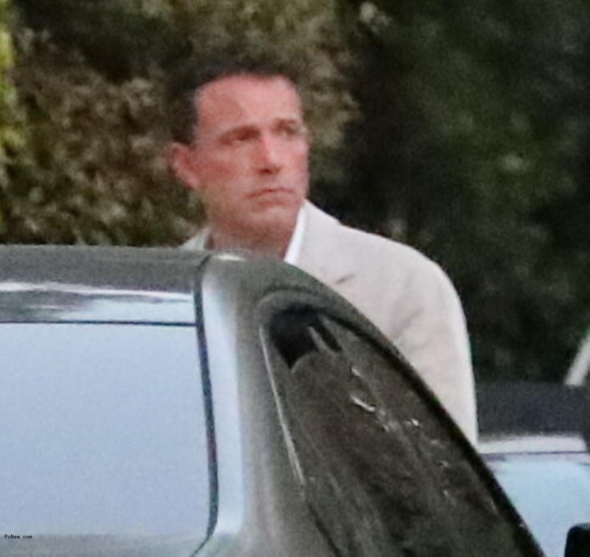 Ben Affleck going to his daughter's graduation party.