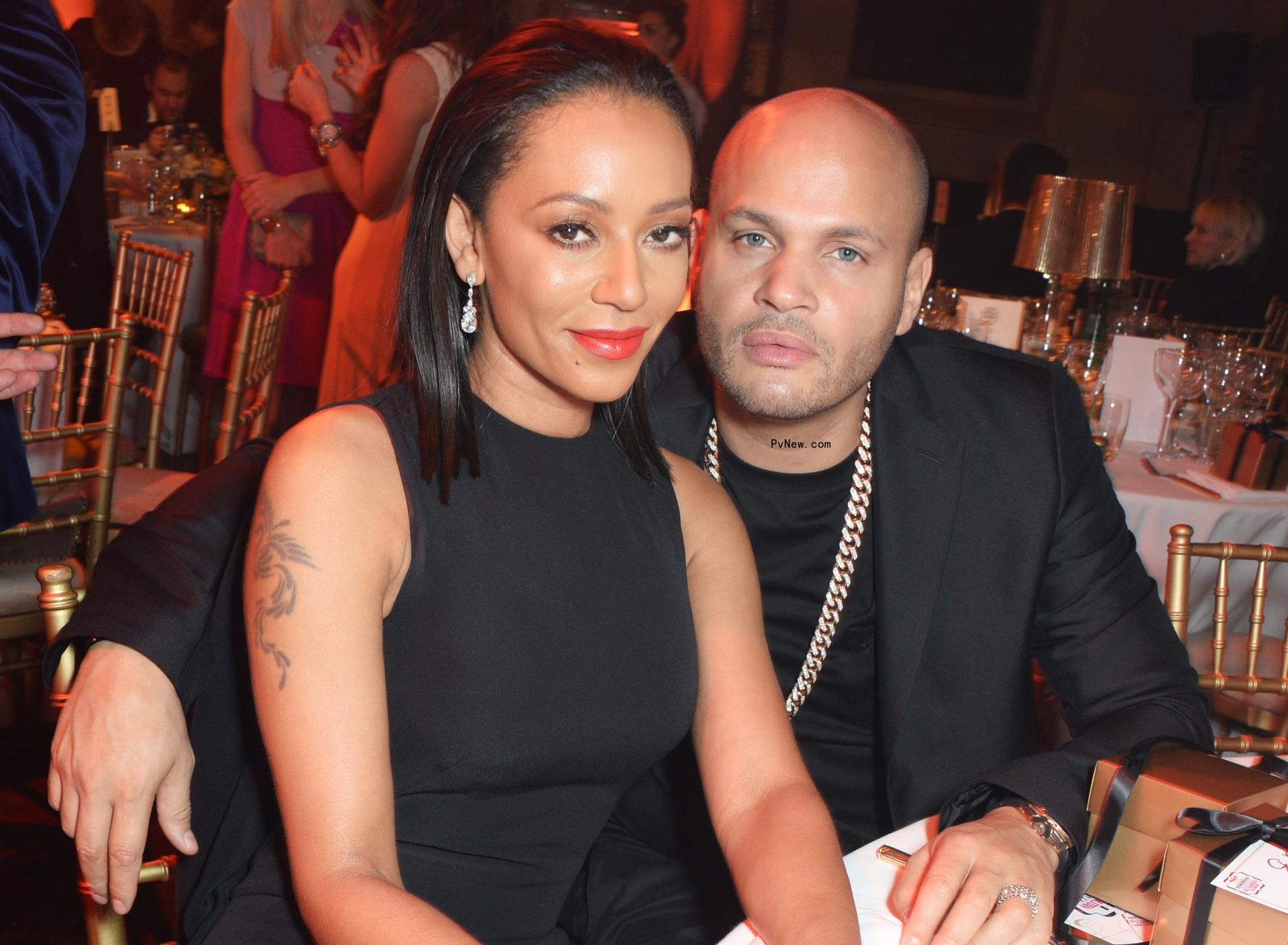 stephen belafo<i></i>nte with his arm wrapped around mel b