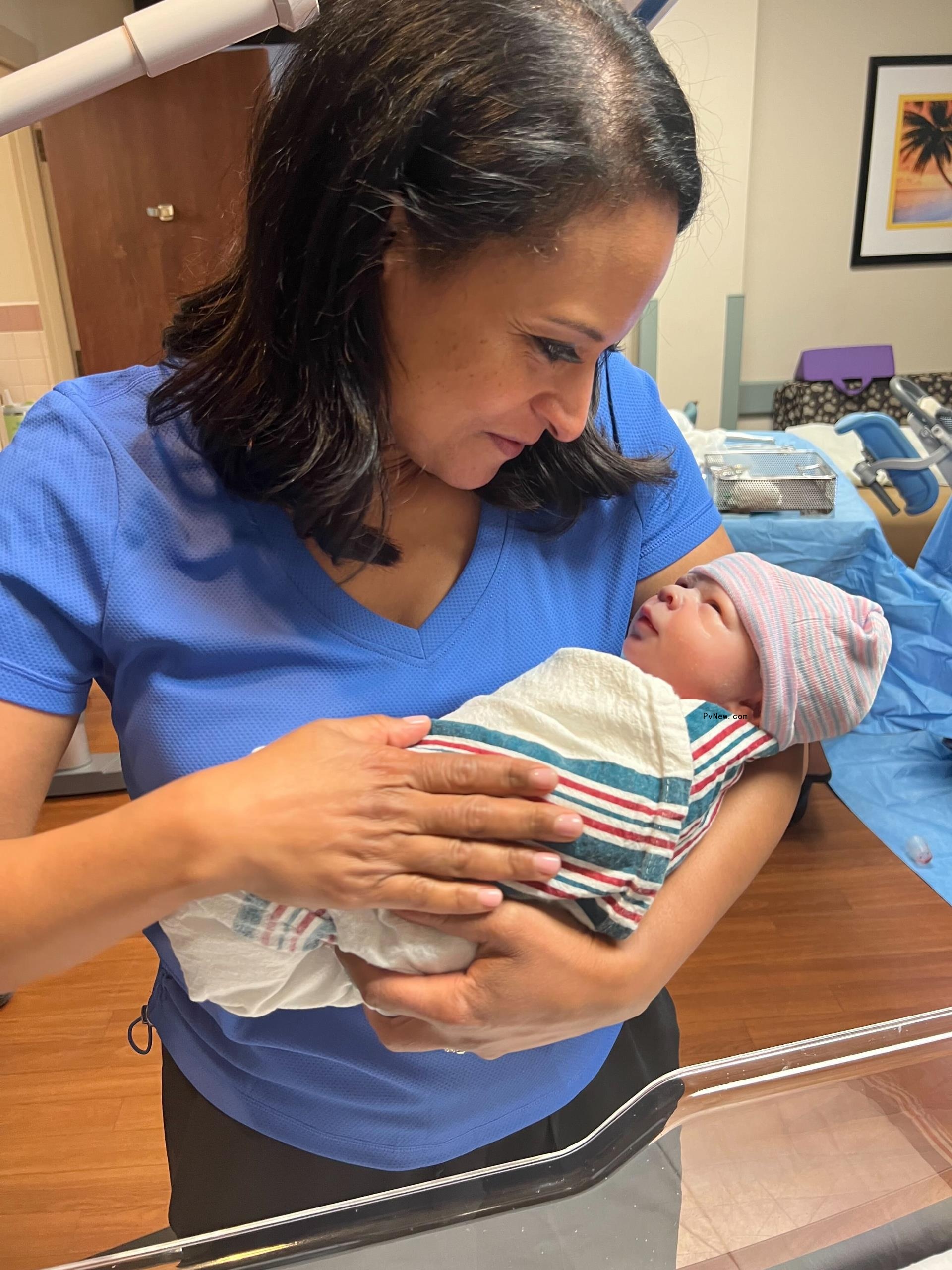 kristen welker holding her newborn baby boy