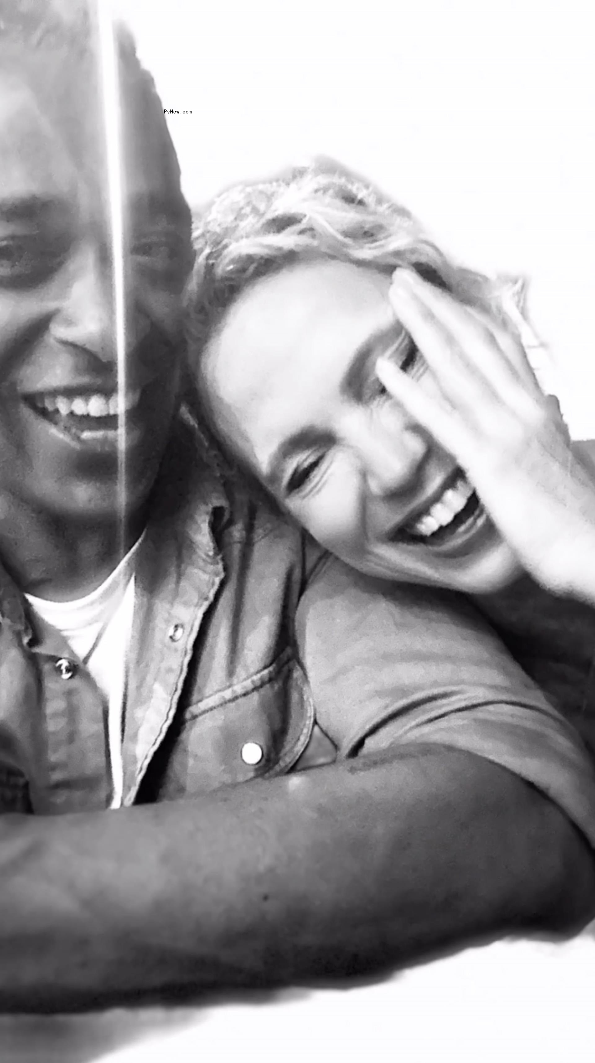 A selfie of TJ Holmes and Amy Robach