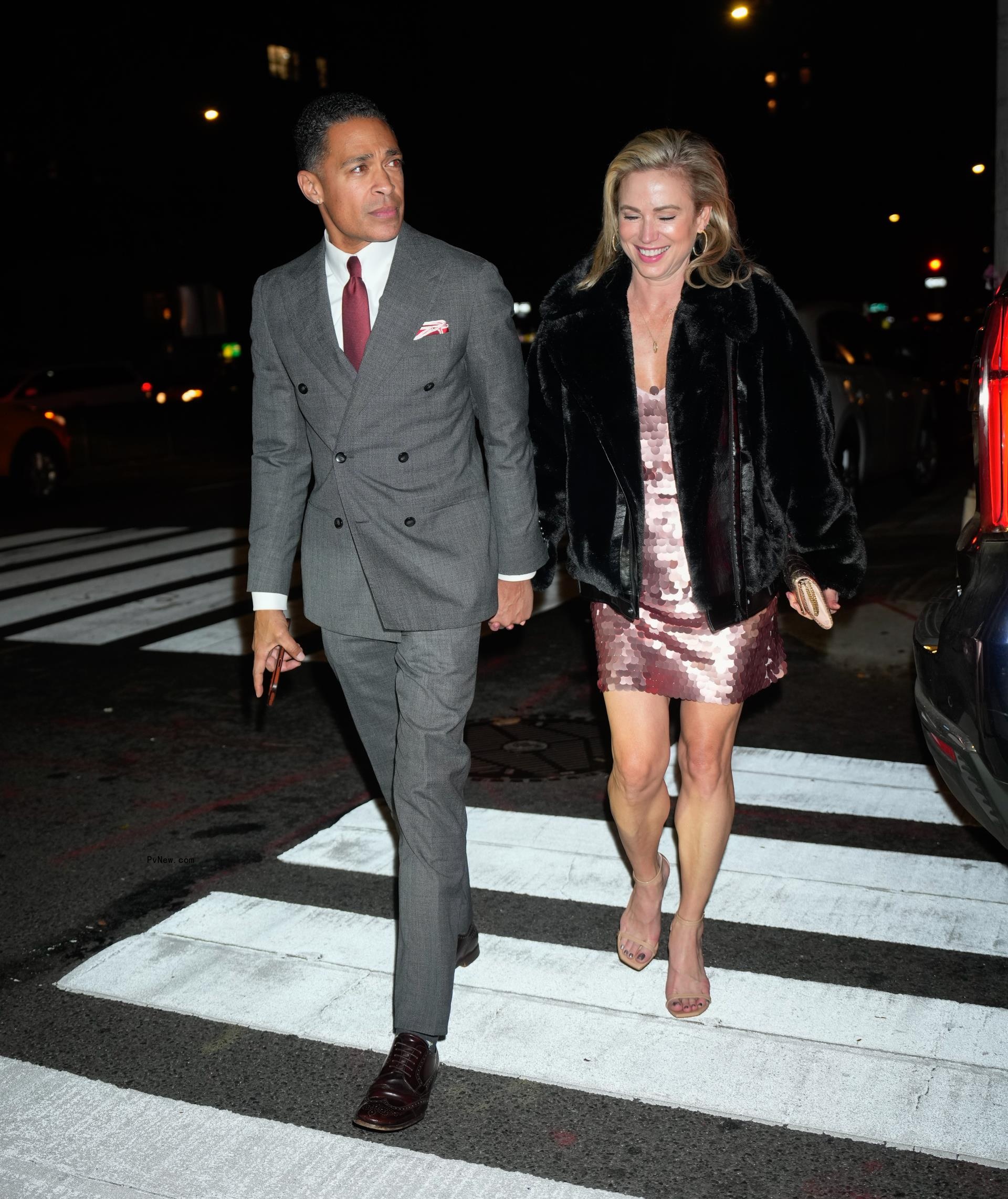 TJ Holmes and Amy Robach holding hands