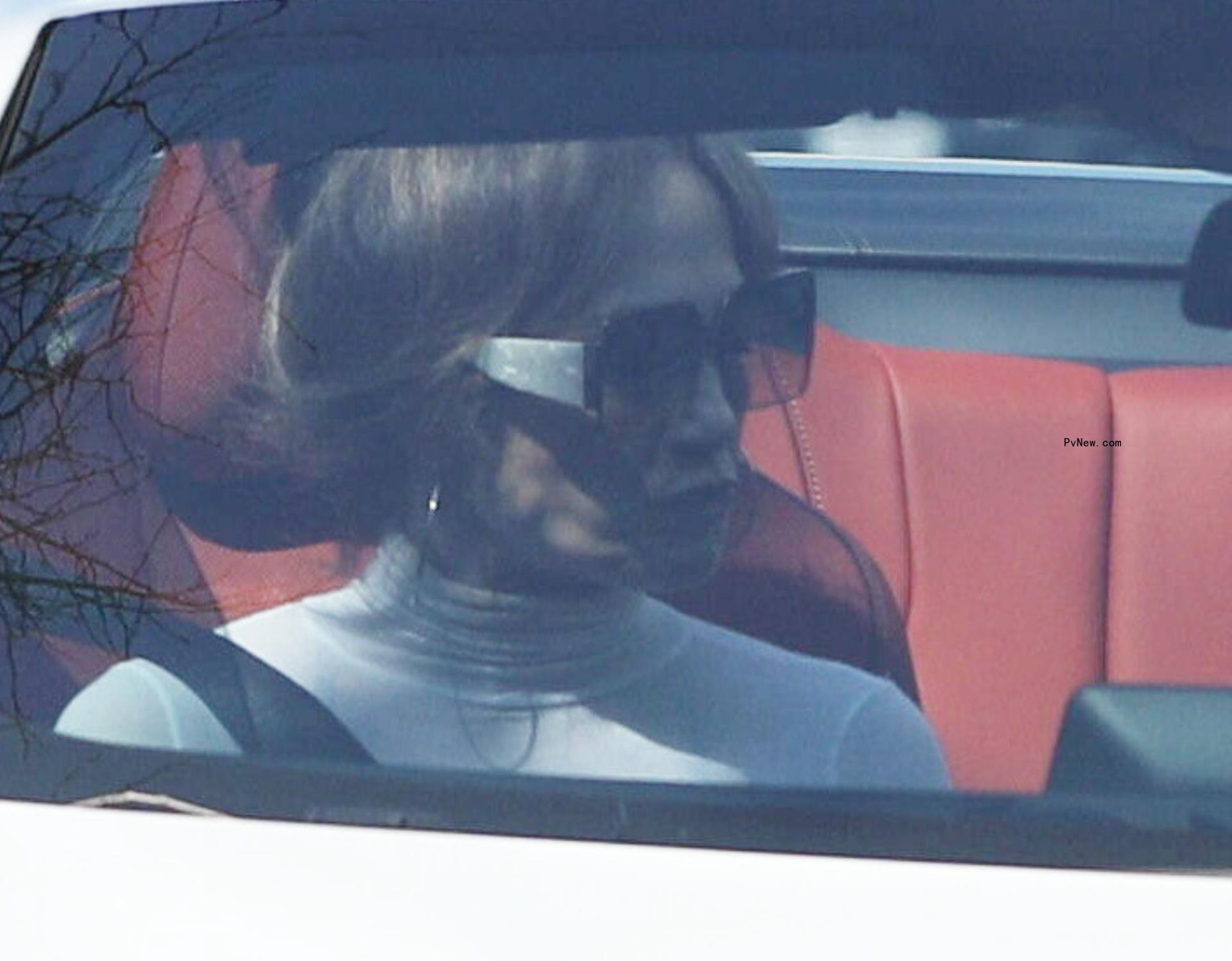 jennifer lopez looking serious in a convertible